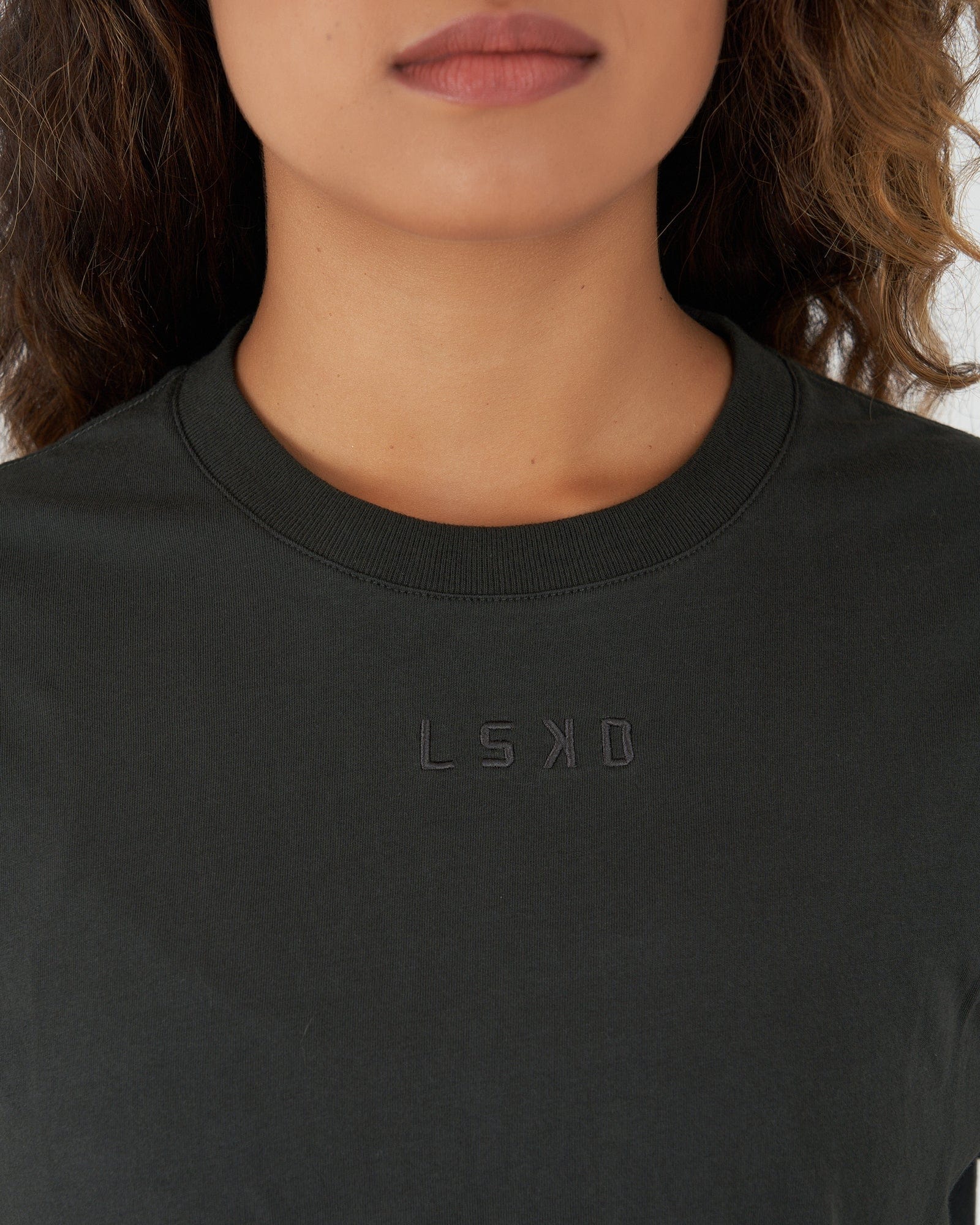 Model wearing Field Crop Tee - Pirate Black