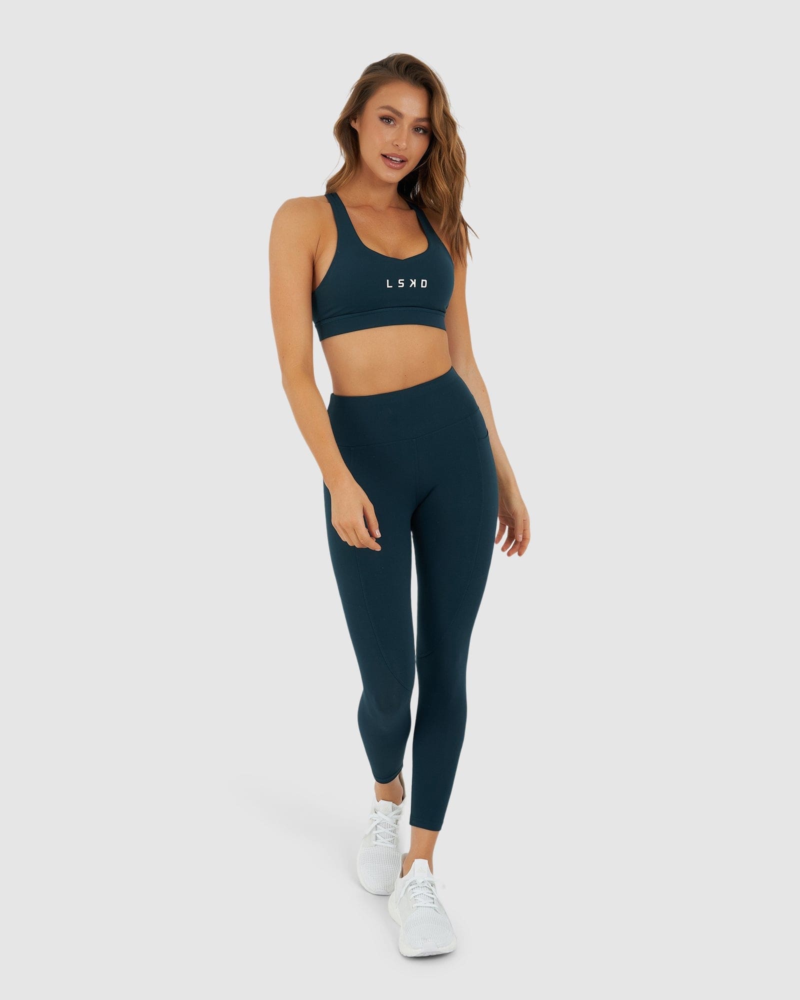 Model wearing Rep Sports Bra Small Logo - Deep Teal