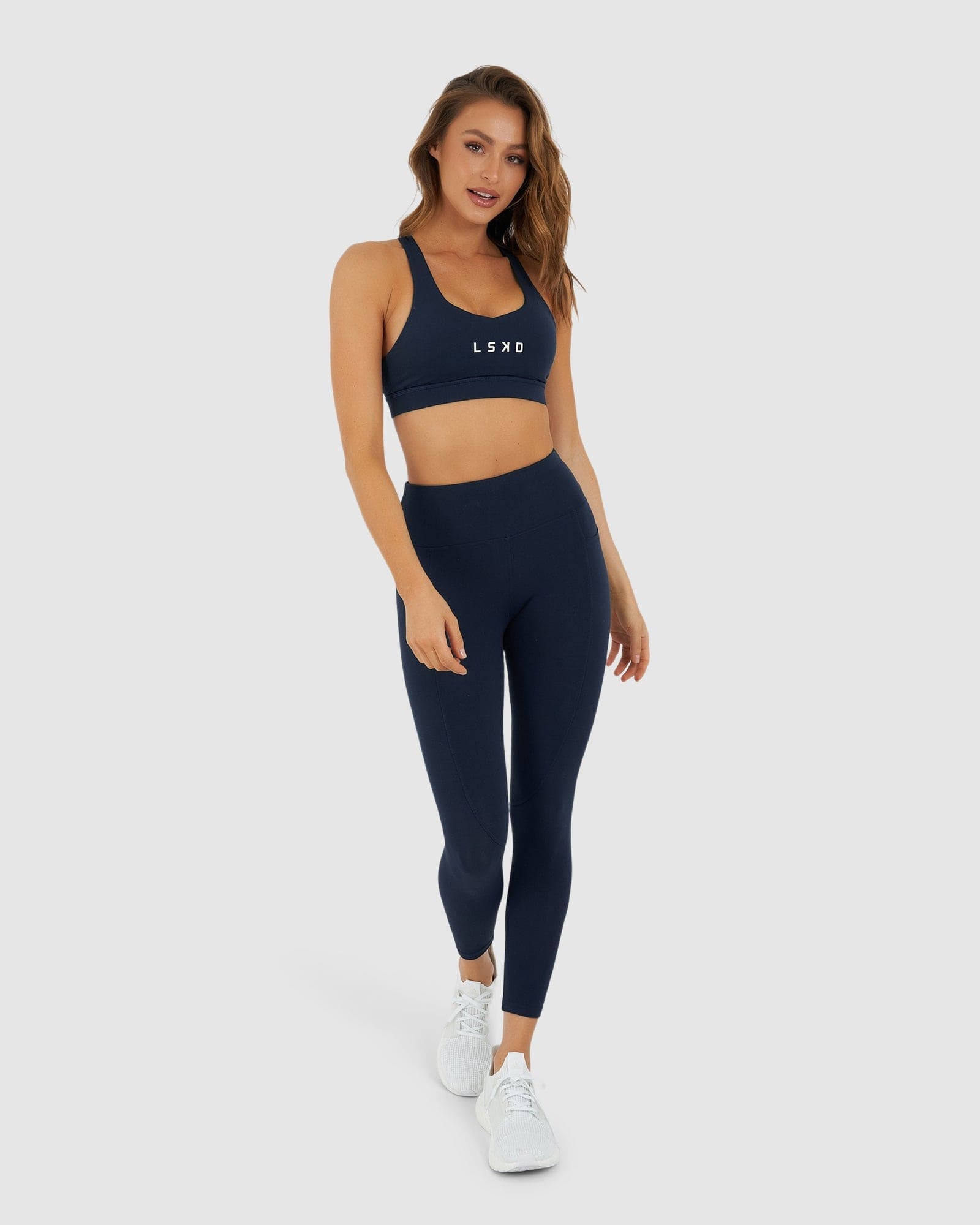 Model wearing Rep 7/8 Length Tight Small Logo - Navy