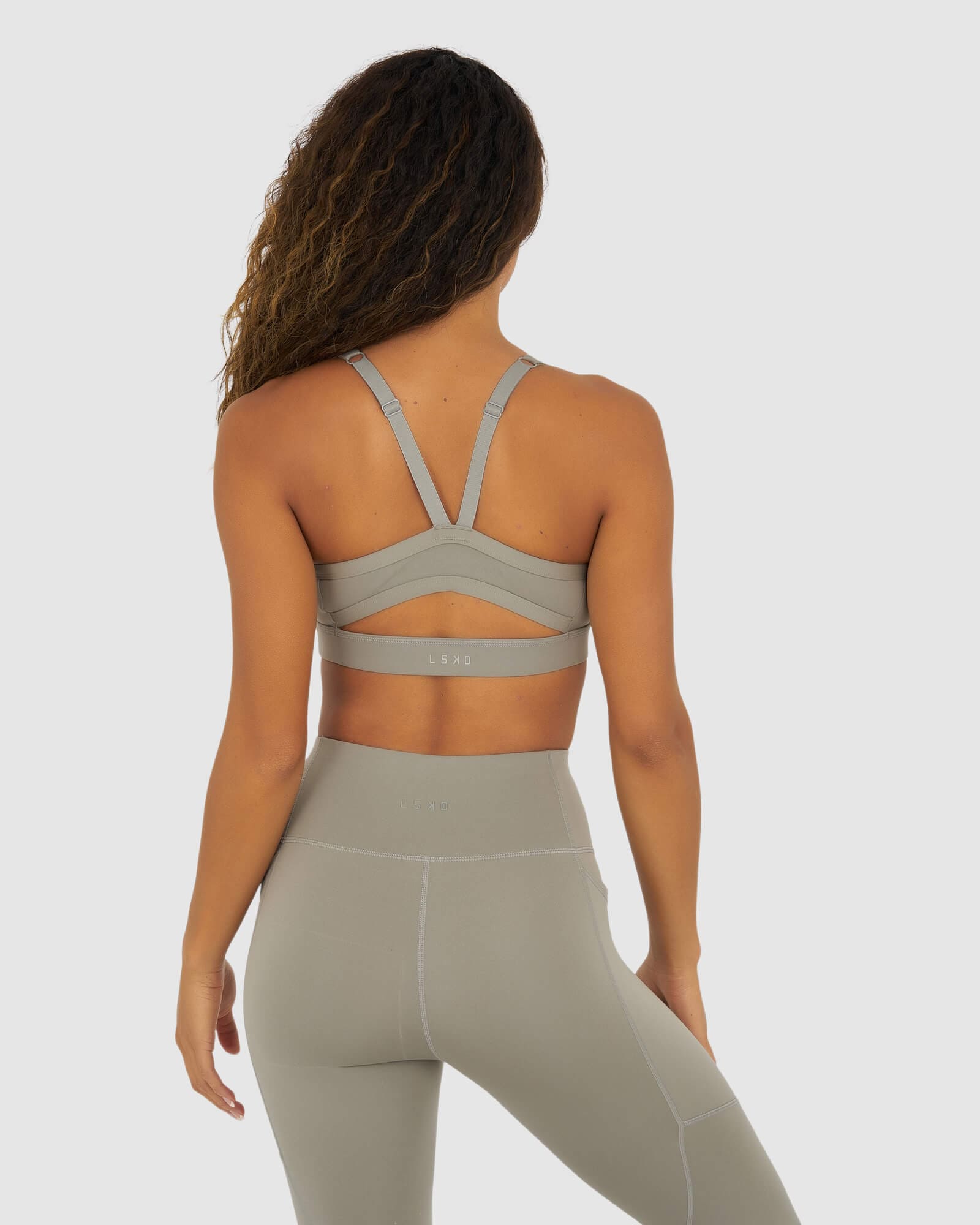 Model wearing Momentum Sports Bra - Gravity