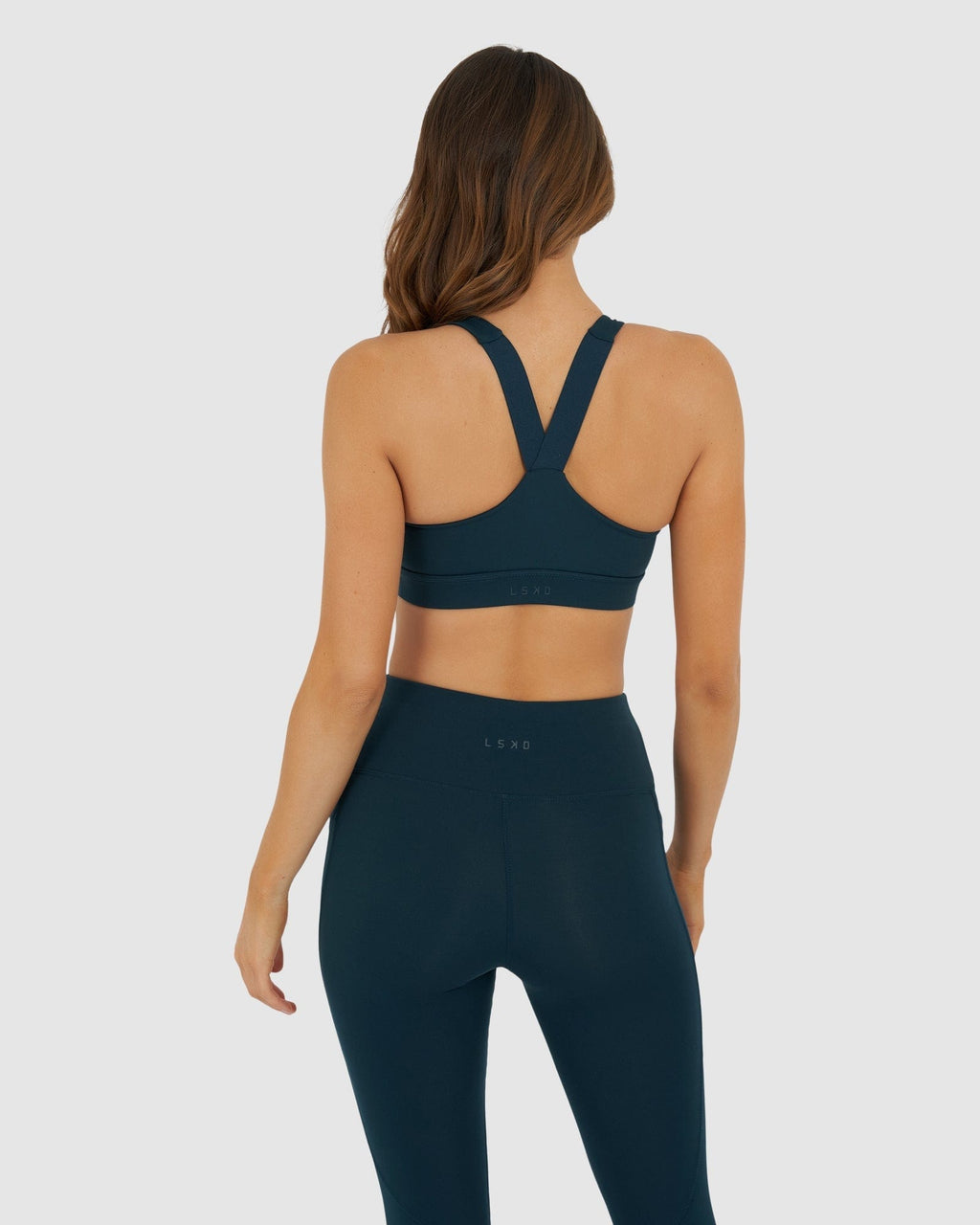 Model wearing Rep Sports Bra Small Logo - Deep Teal