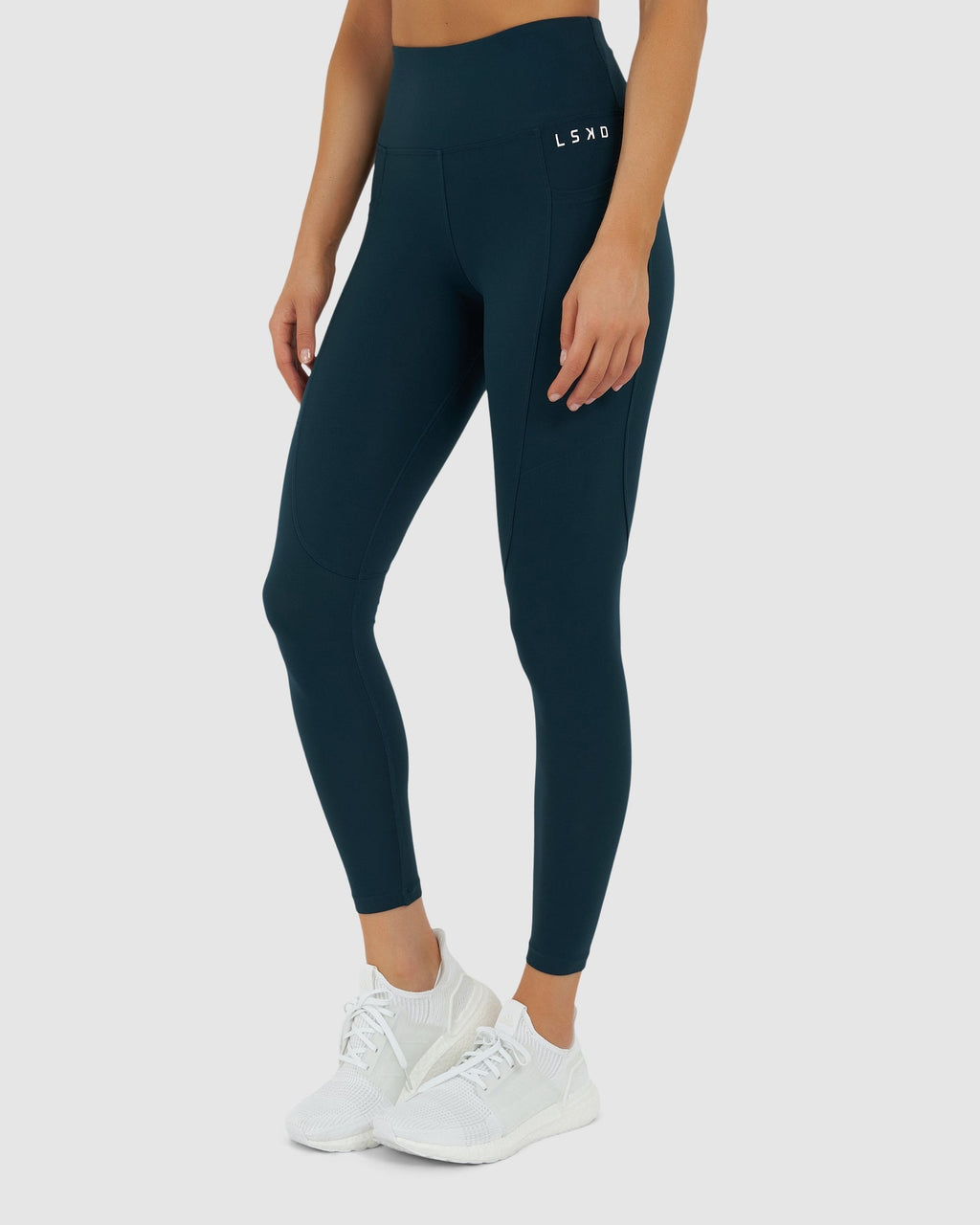 Model wearing Rep 7/8 Length Tight Small Logo - Deep Teal