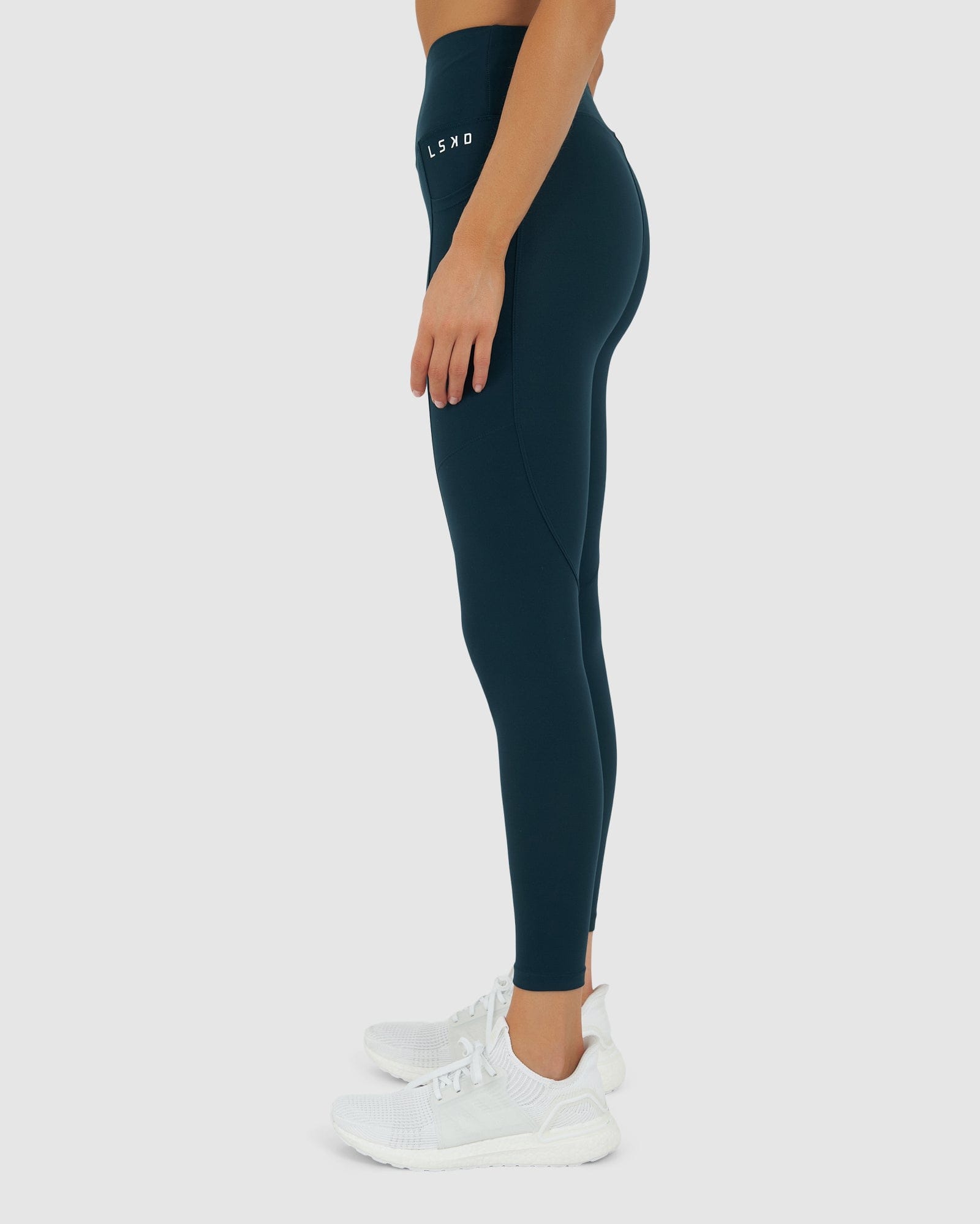 Model wearing Rep 7/8 Length Tight Small Logo - Deep Teal