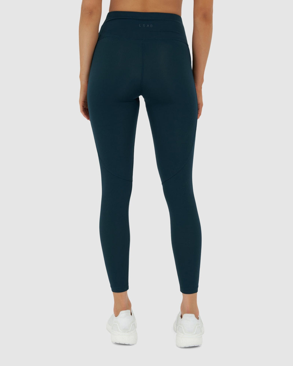 Model wearing Rep 7/8 Length Tight Small Logo - Deep Teal