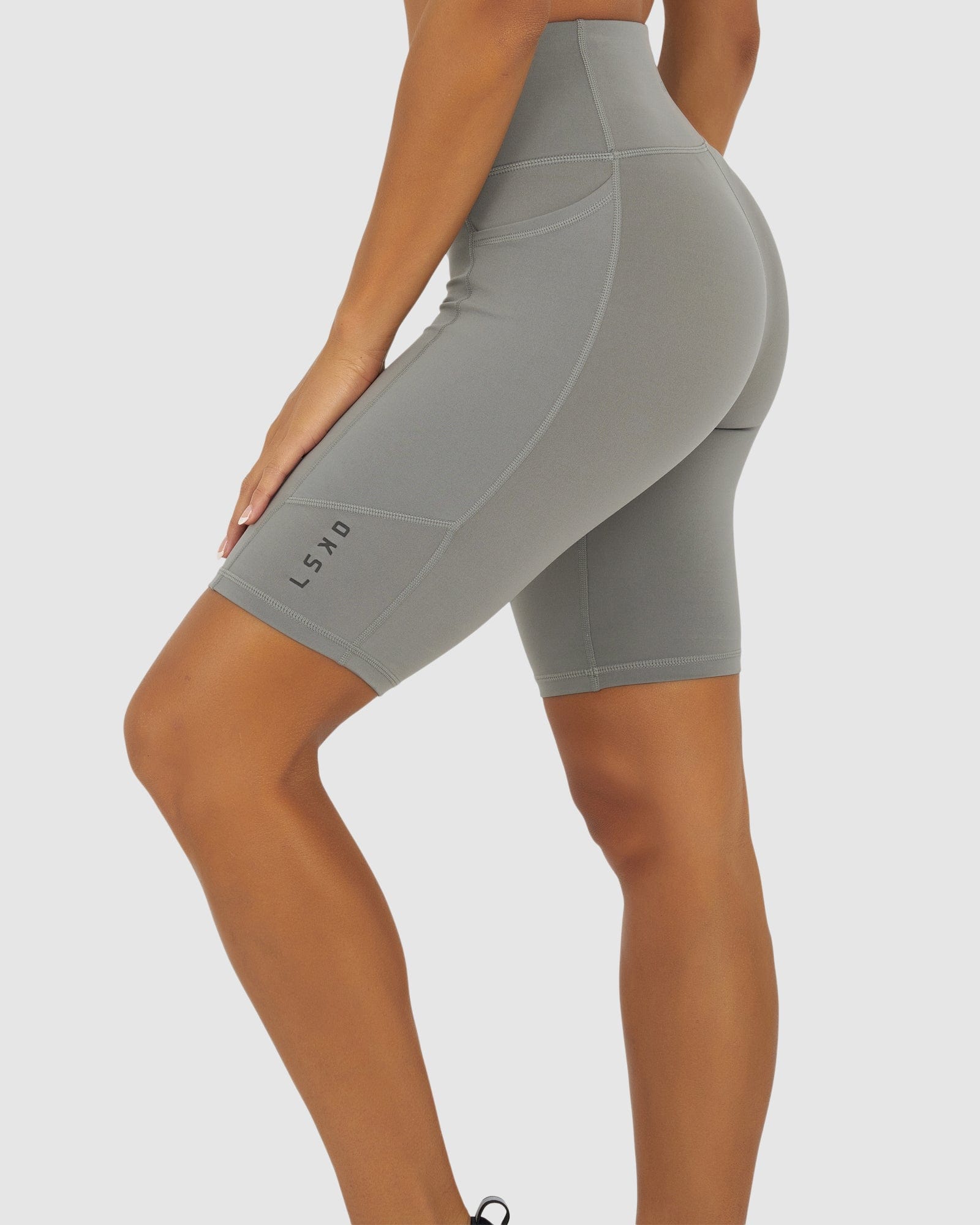 Model wearing Rep Short Tight Small Logo - Frost Grey