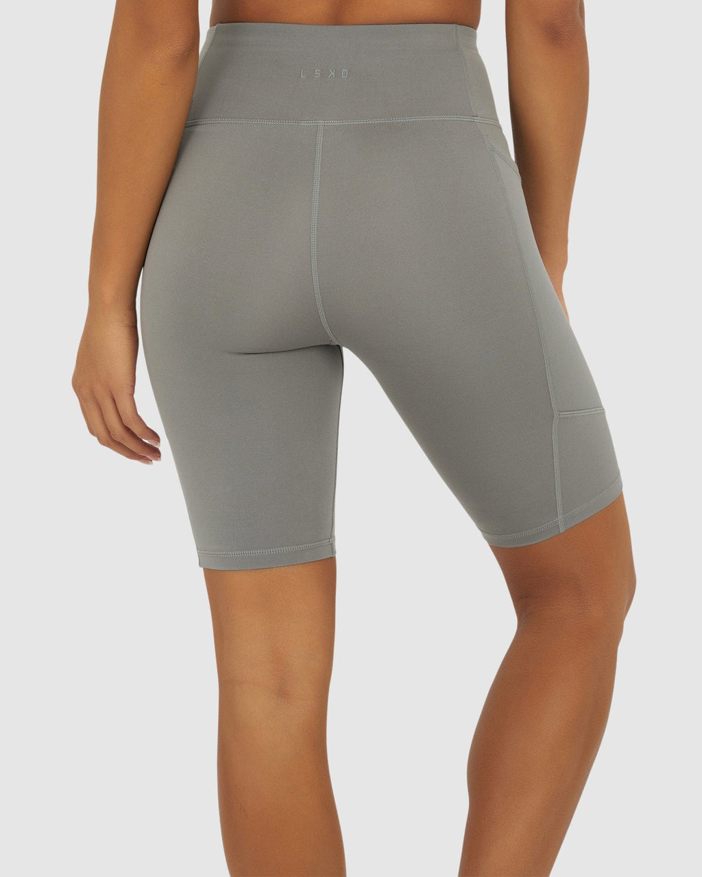 Model wearing Rep Short Tight Small Logo - Frost Grey