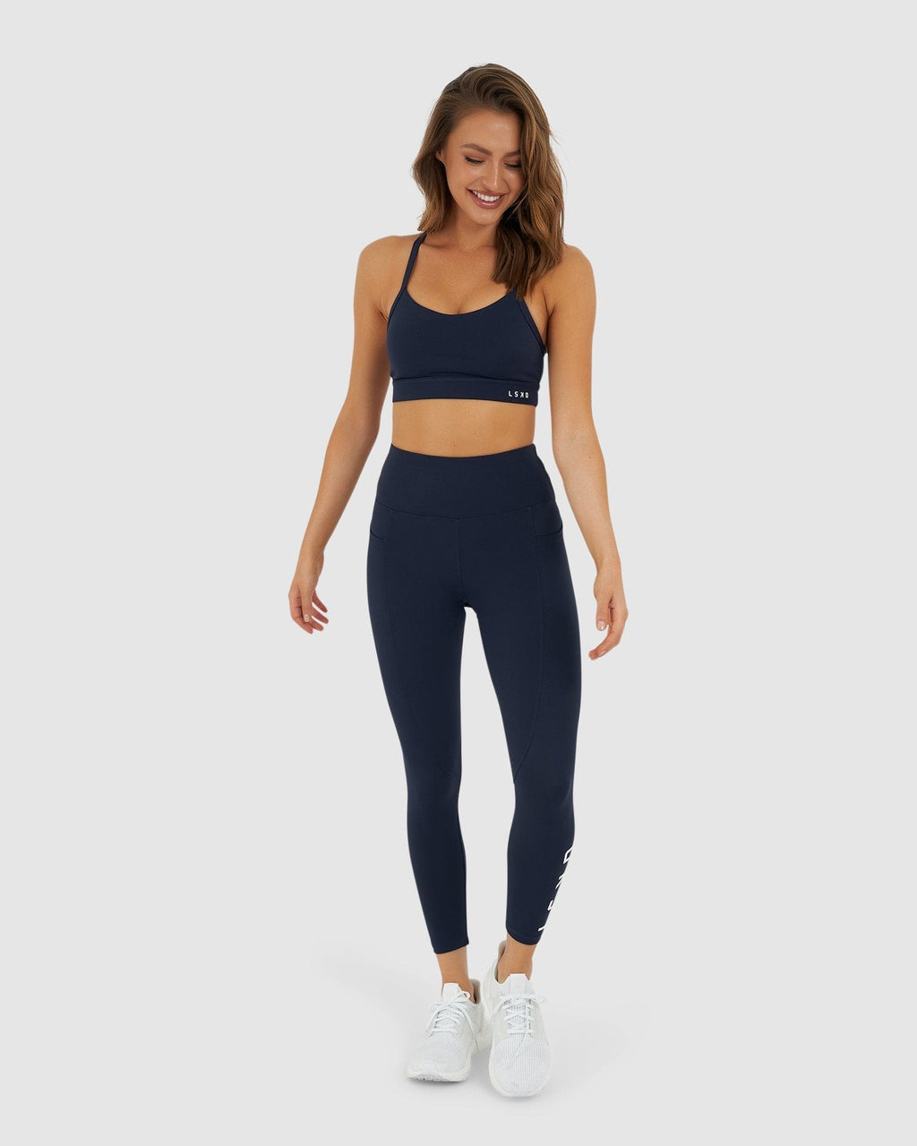 Model wearing Momentum Sports Bra - Navy