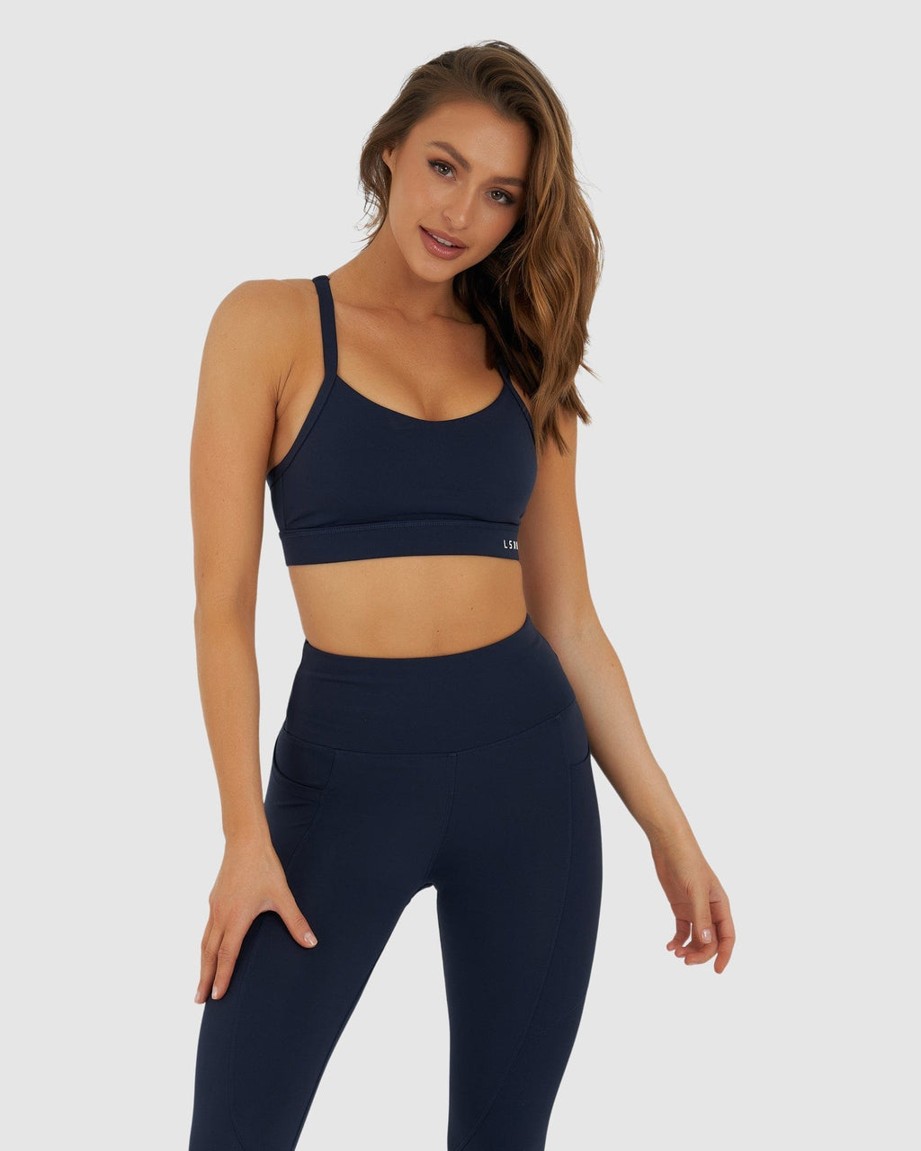 Model wearing Momentum Sports Bra - Navy