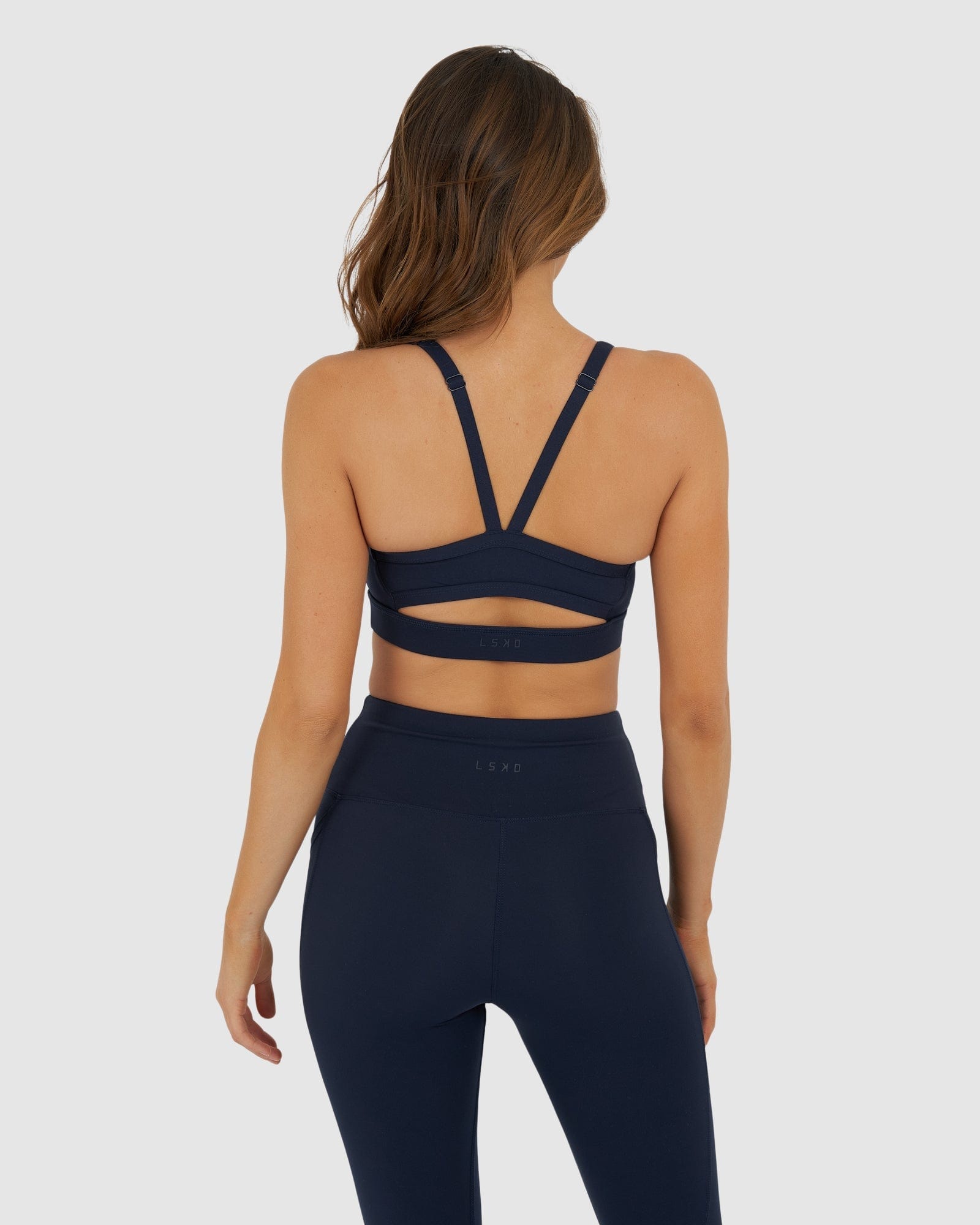 Model wearing Momentum Sports Bra - Navy