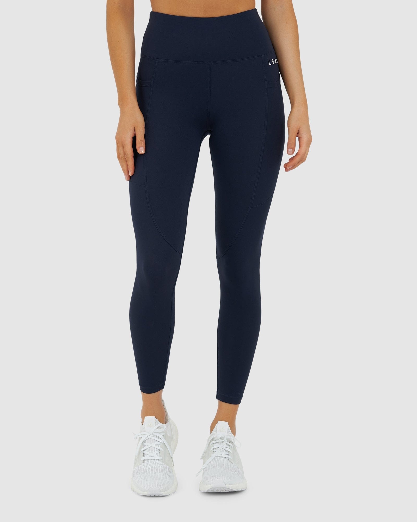 Model wearing Rep 7/8 Length Tight Small Logo - Navy