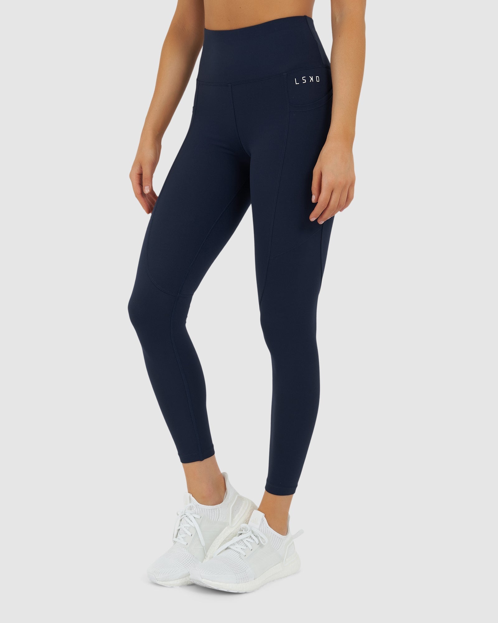Model wearing Rep 7/8 Length Tight Small Logo - Navy