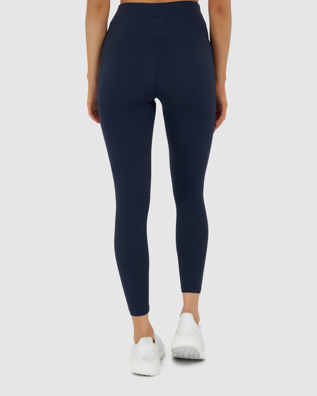 Model wearing Rep 7/8 Length Tight Small Logo - Navy