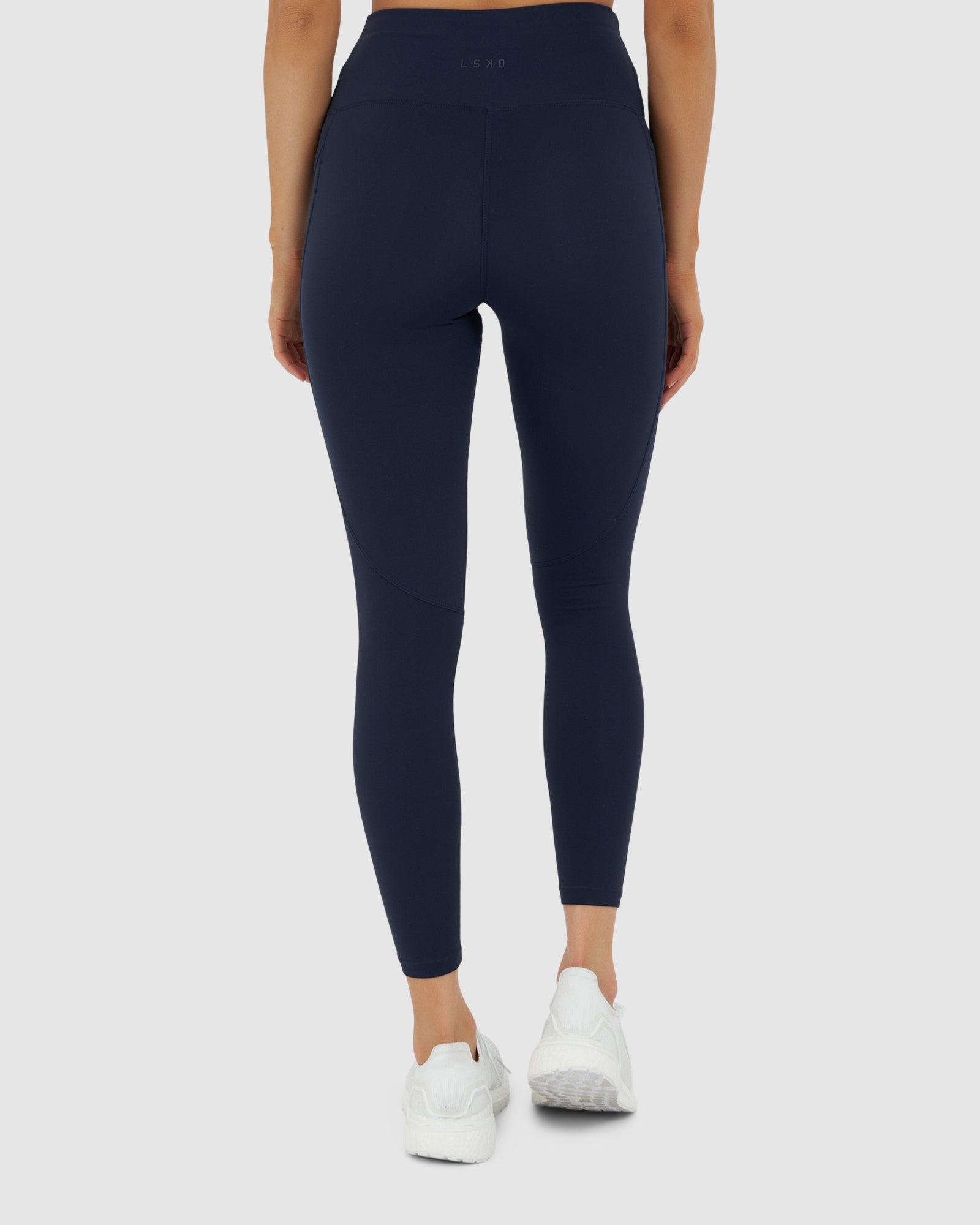Model wearing Rep 7/8 Length Tight Small Logo - Navy