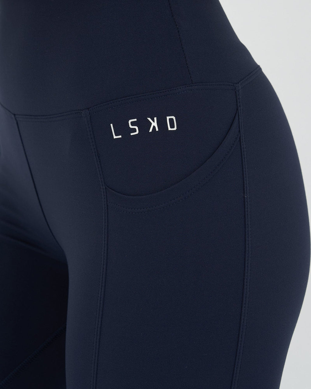 Model wearing Rep 7/8 Length Tight Small Logo - Navy