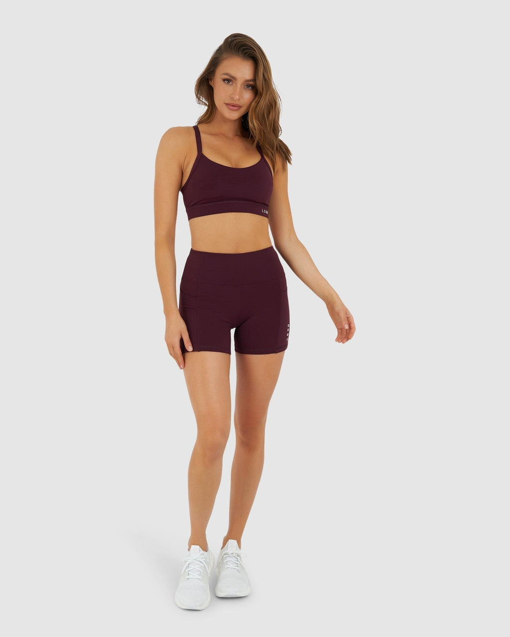 Model wearing Momentum Sports Bra - Wine