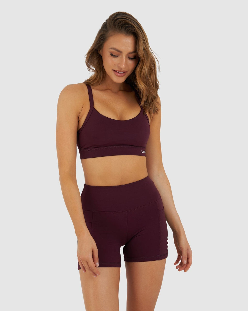 Model wearing Momentum Sports Bra - Wine