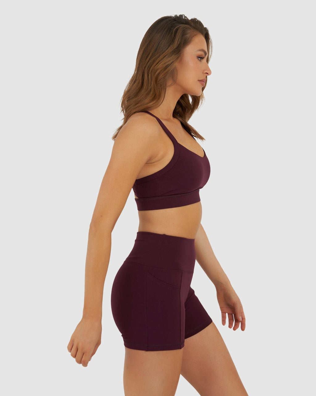 Model wearing Momentum Sports Bra - Wine