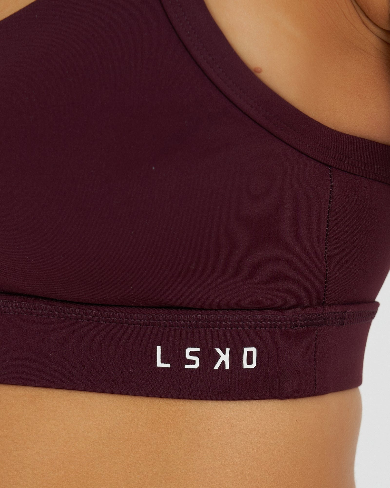 Model wearing Momentum Sports Bra - Wine