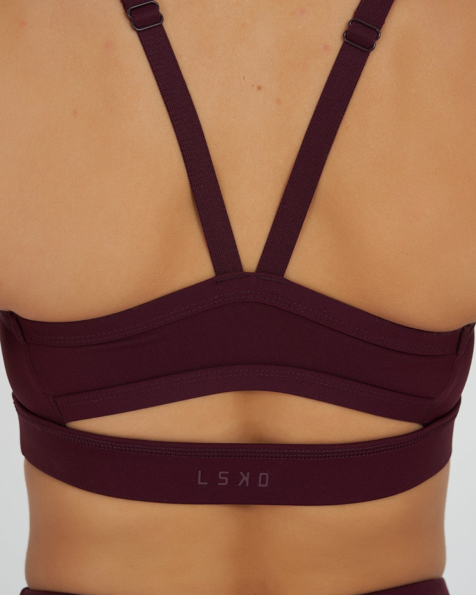 Model wearing Momentum Sports Bra - Wine