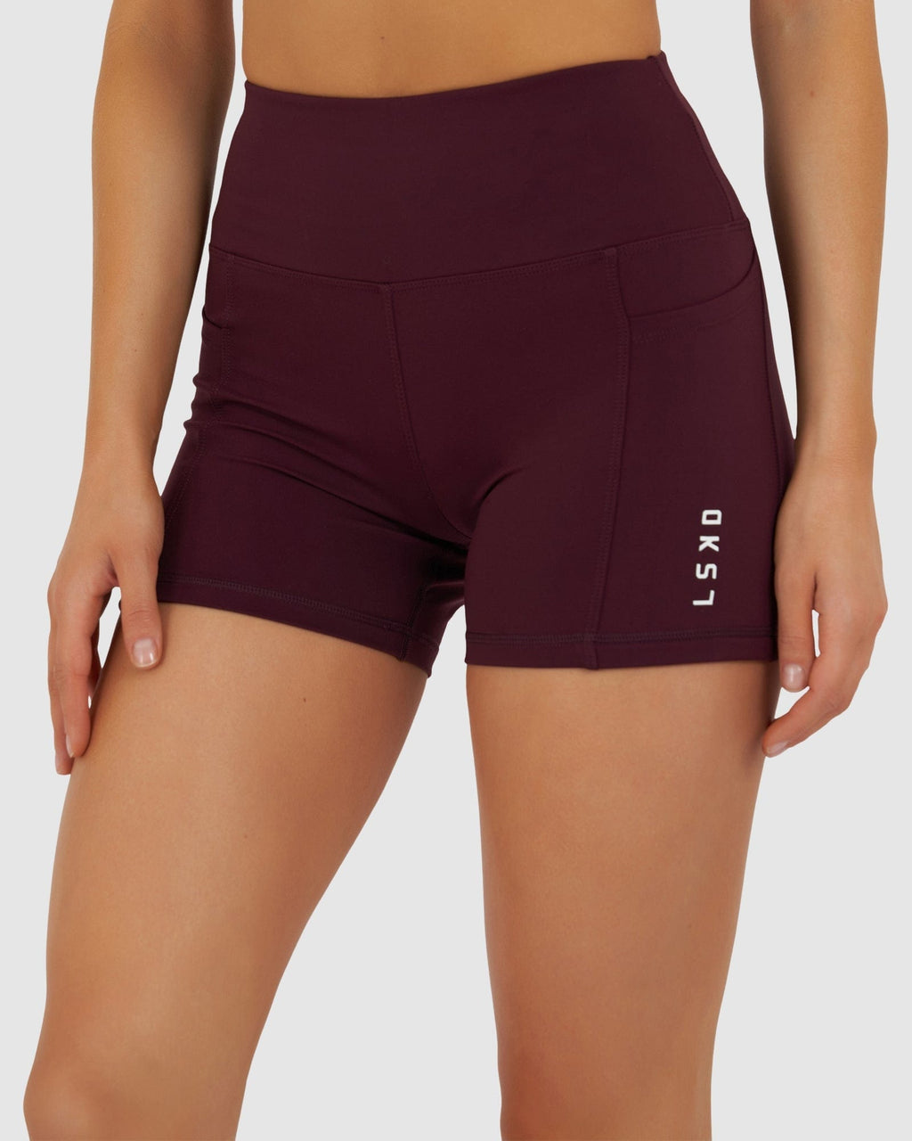 Model wearing Rep X-Short Tight Small Logo - Wine