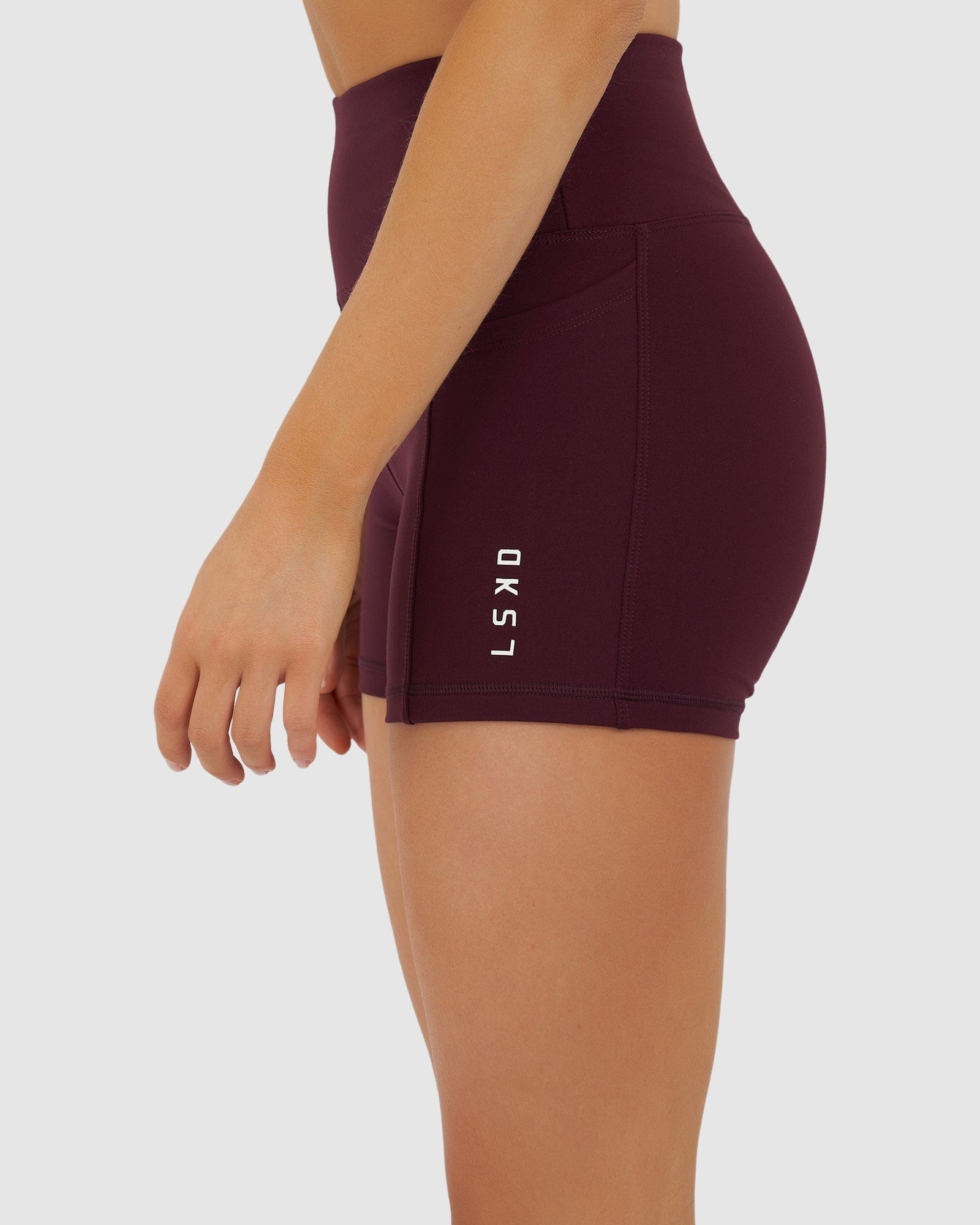 Model wearing Rep X-Short Tight Small Logo - Wine