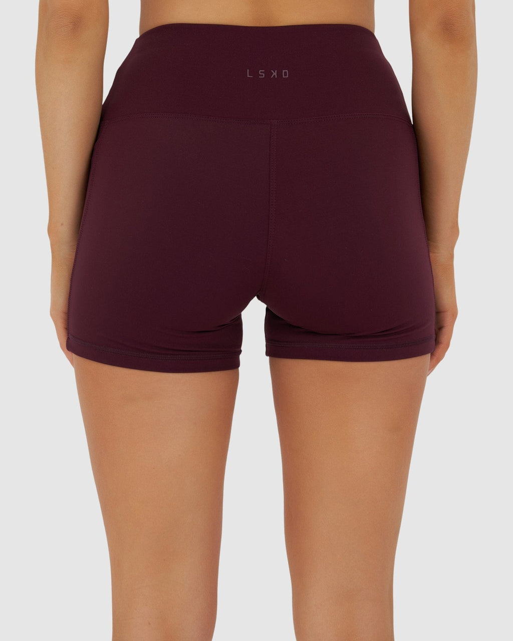 Model wearing Rep X-Short Tight Small Logo - Wine