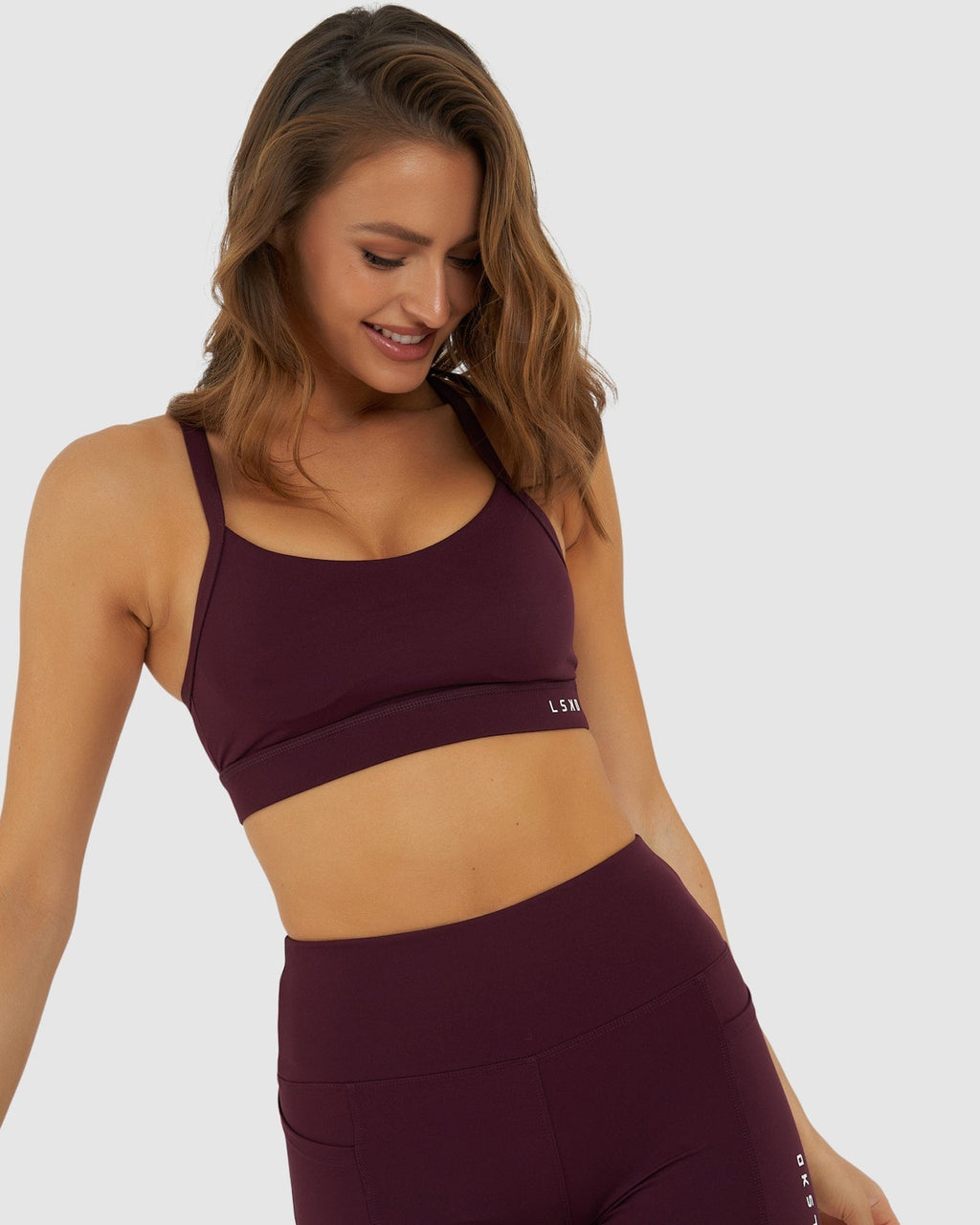Model wearing Momentum Sports Bra - Wine