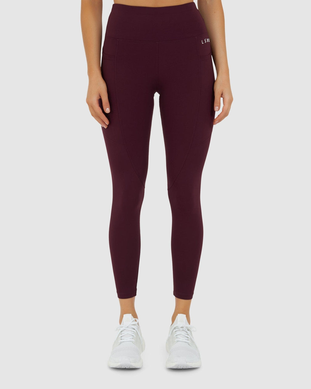 Model wearing Rep 7/8 Length Tight Small Logo - Wine