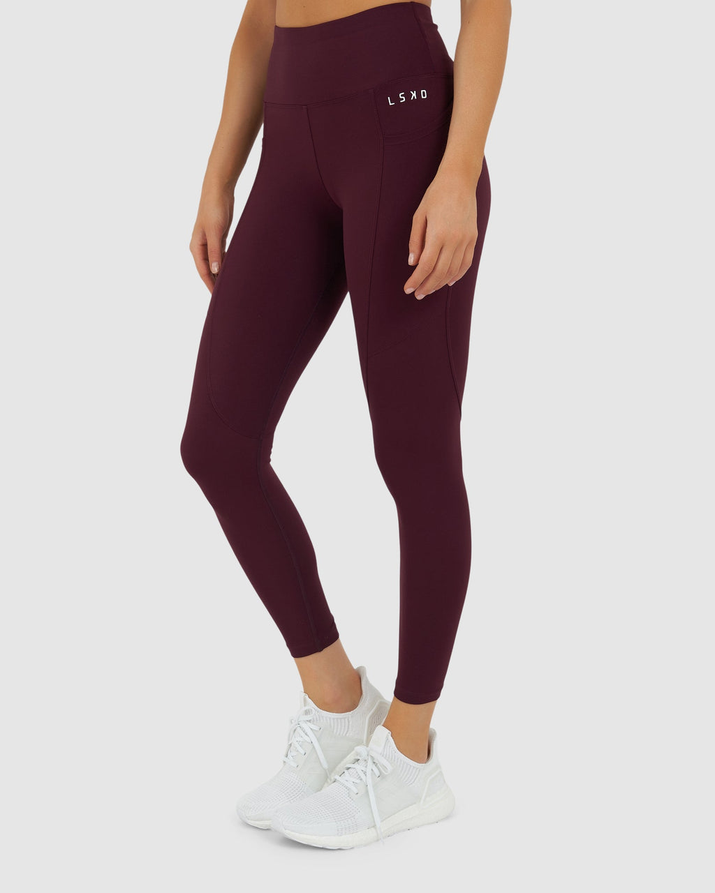 Model wearing Rep 7/8 Length Tight Small Logo - Wine