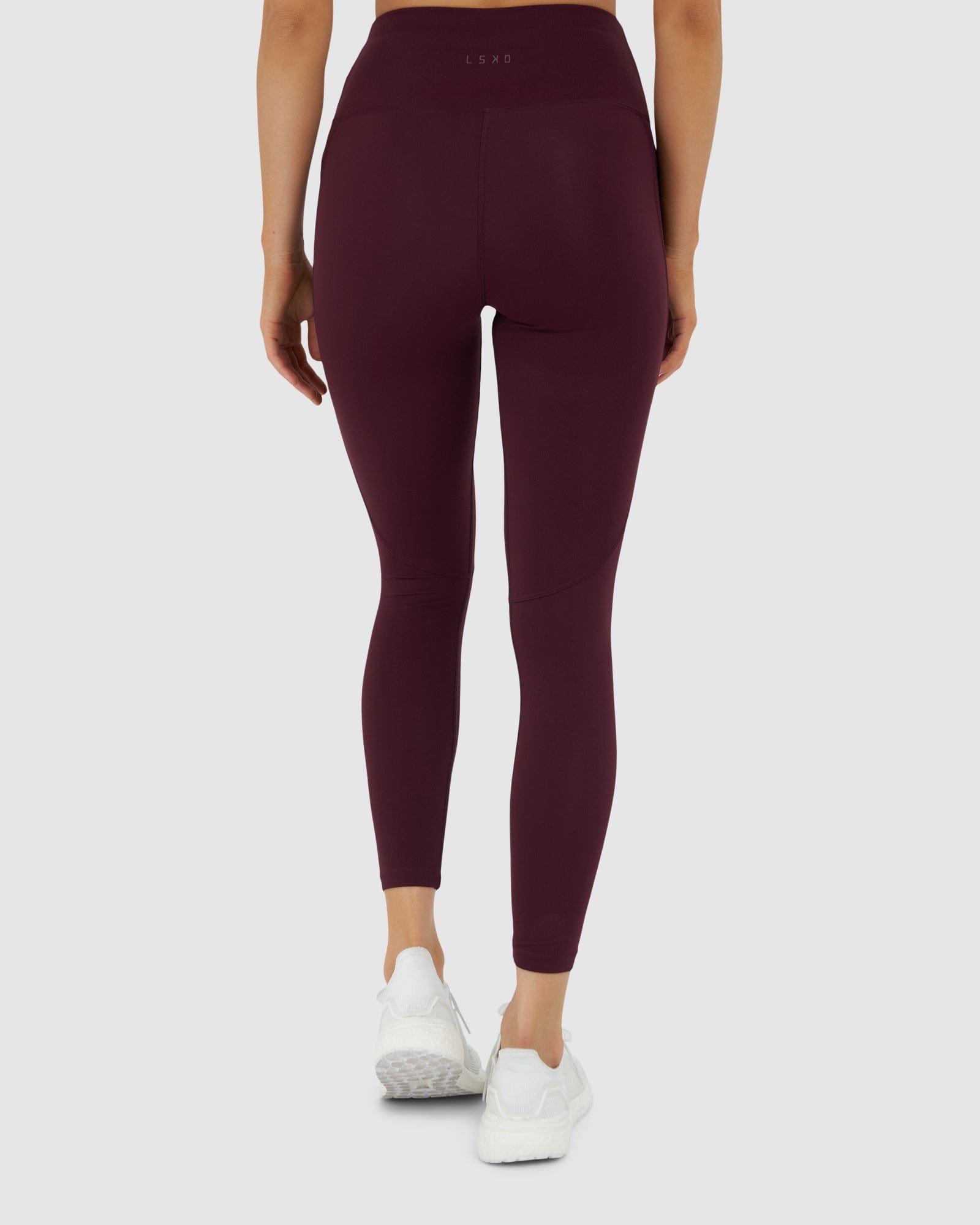 Model wearing Rep 7/8 Length Tight Small Logo - Wine
