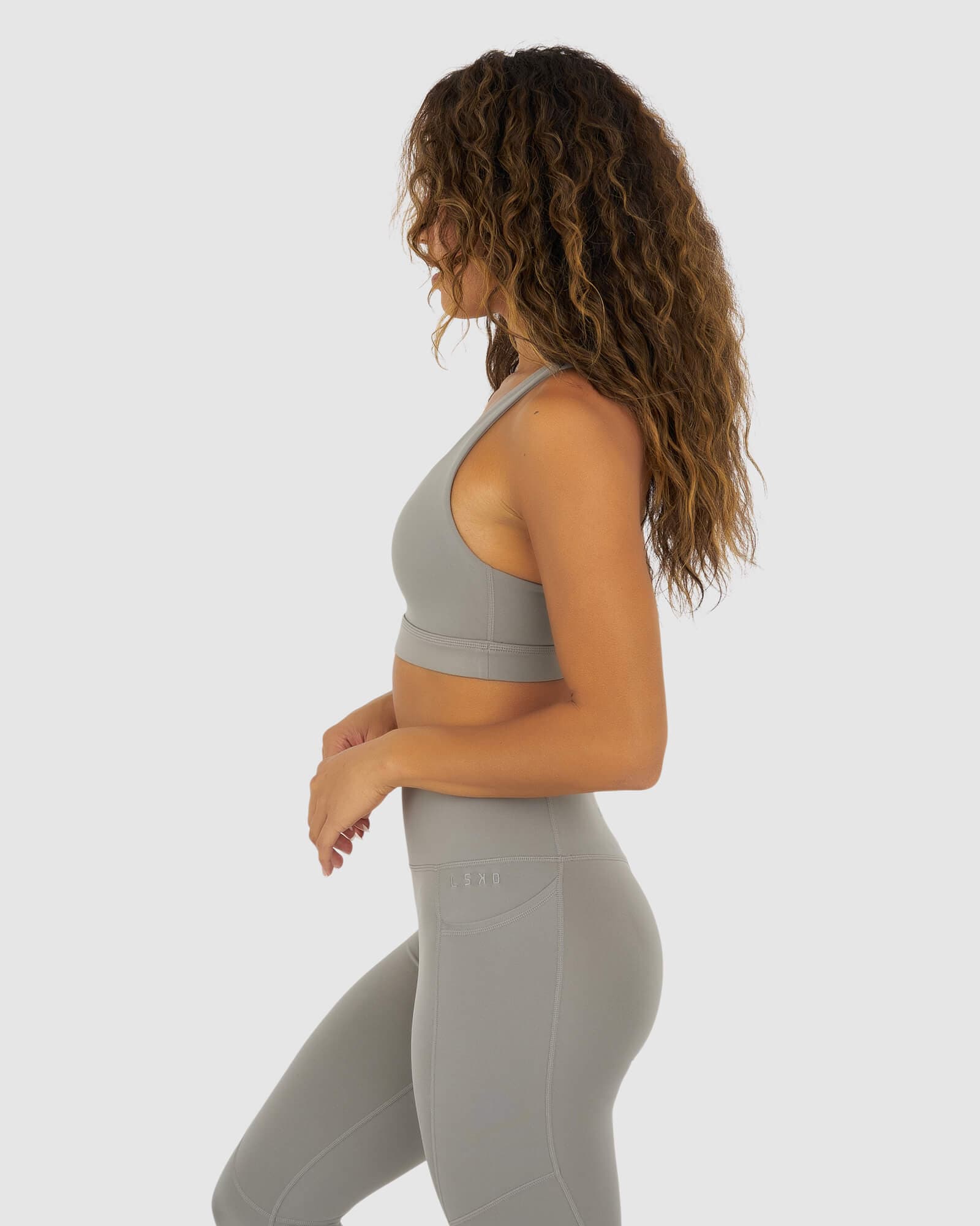 Model wearing Rep Sports Bra Small Logo - Frost Grey