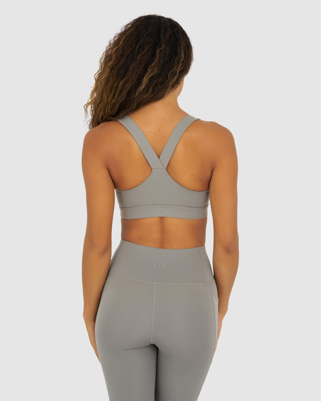 Model wearing Rep Sports Bra Small Logo - Frost Grey