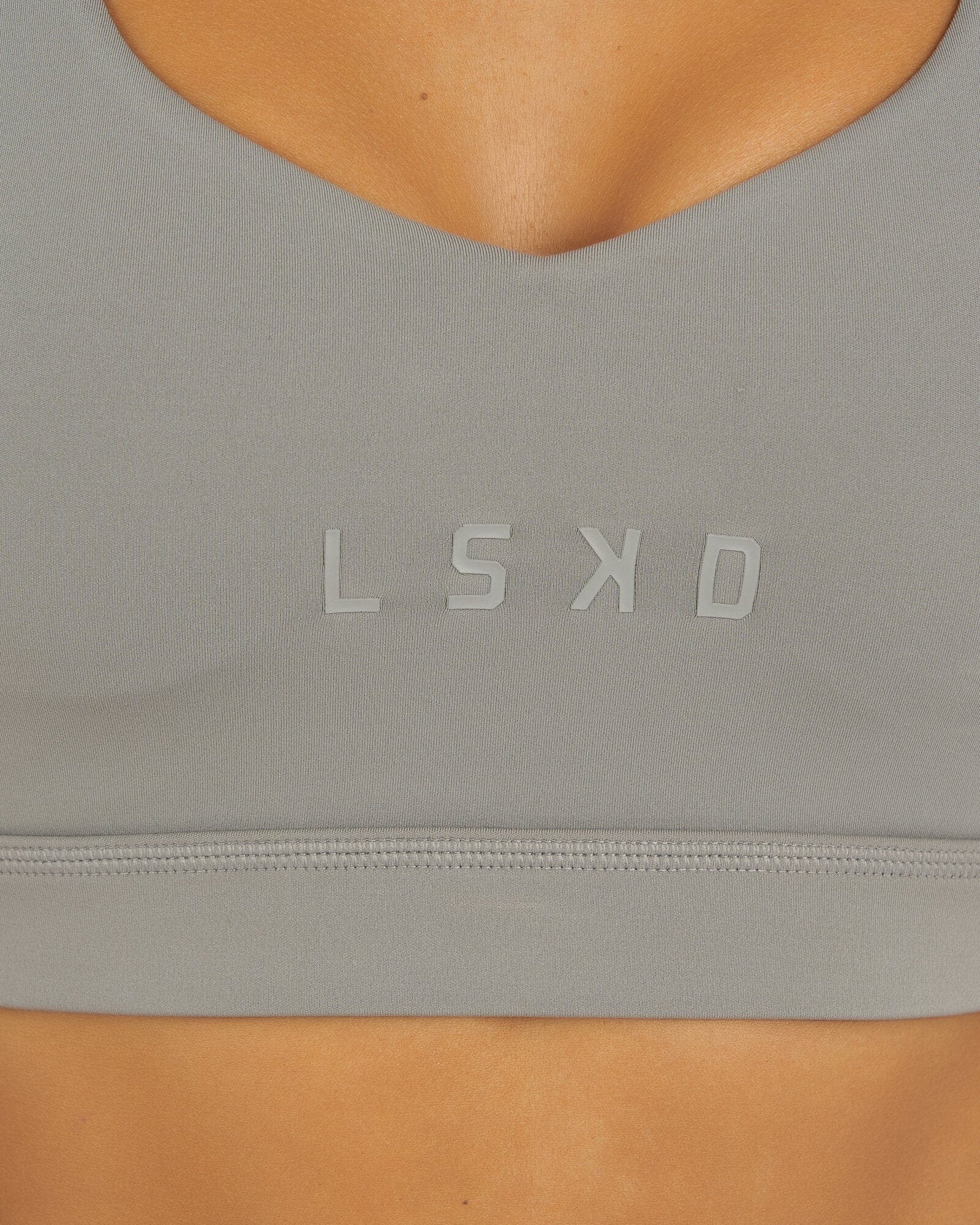 Model wearing Rep Sports Bra Small Logo - Frost Grey