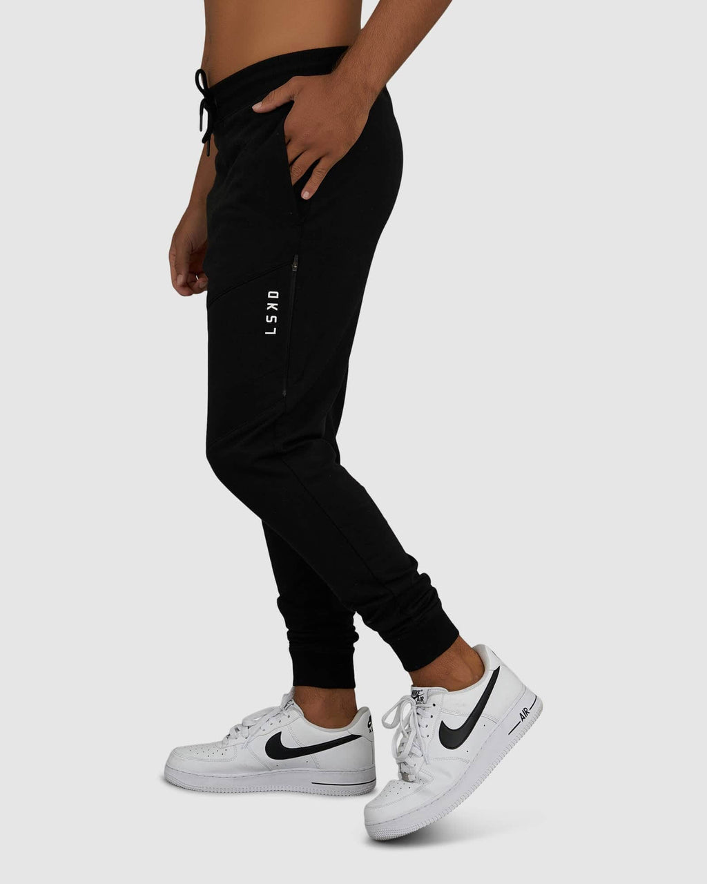 Model wearing Unisex Rep Jogger - Black