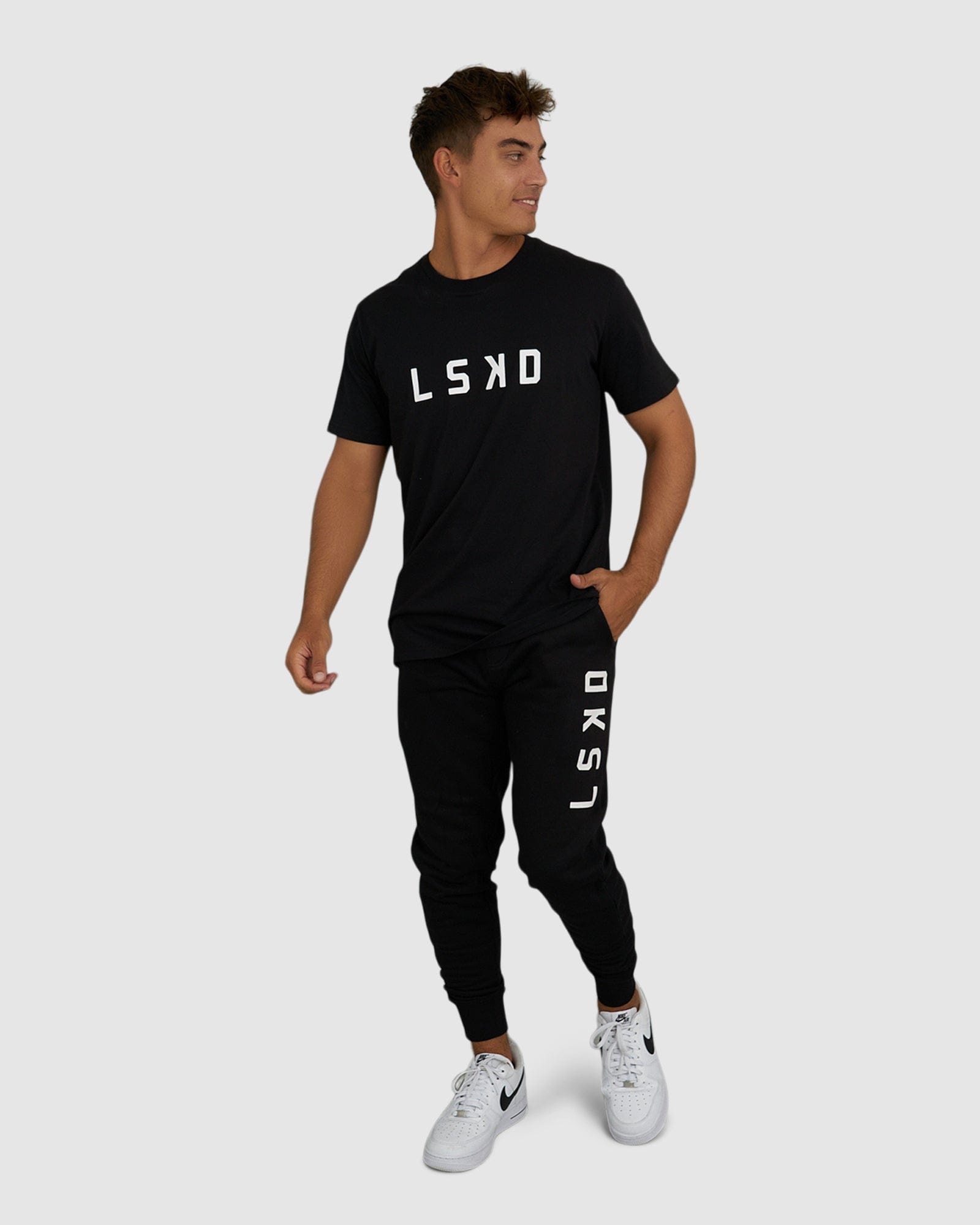 Model wearing Structure Track Pant - Black-White