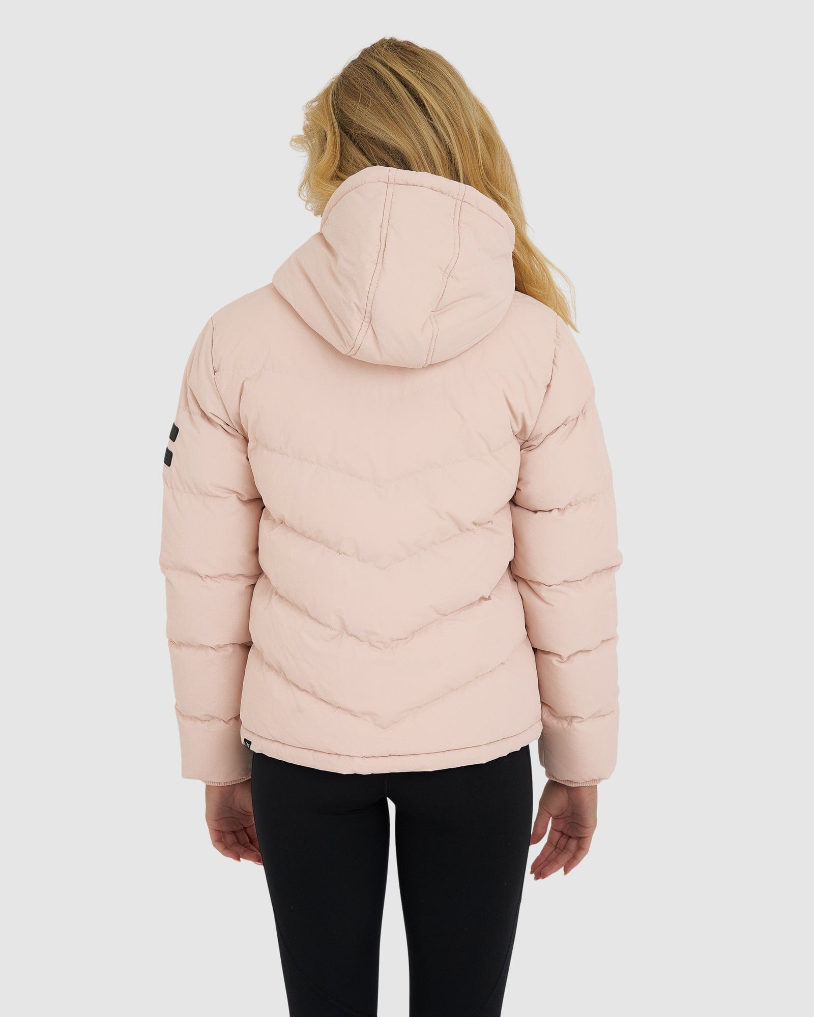 Model wearing Roasted Puffer Jacket 21 - Peach Whip