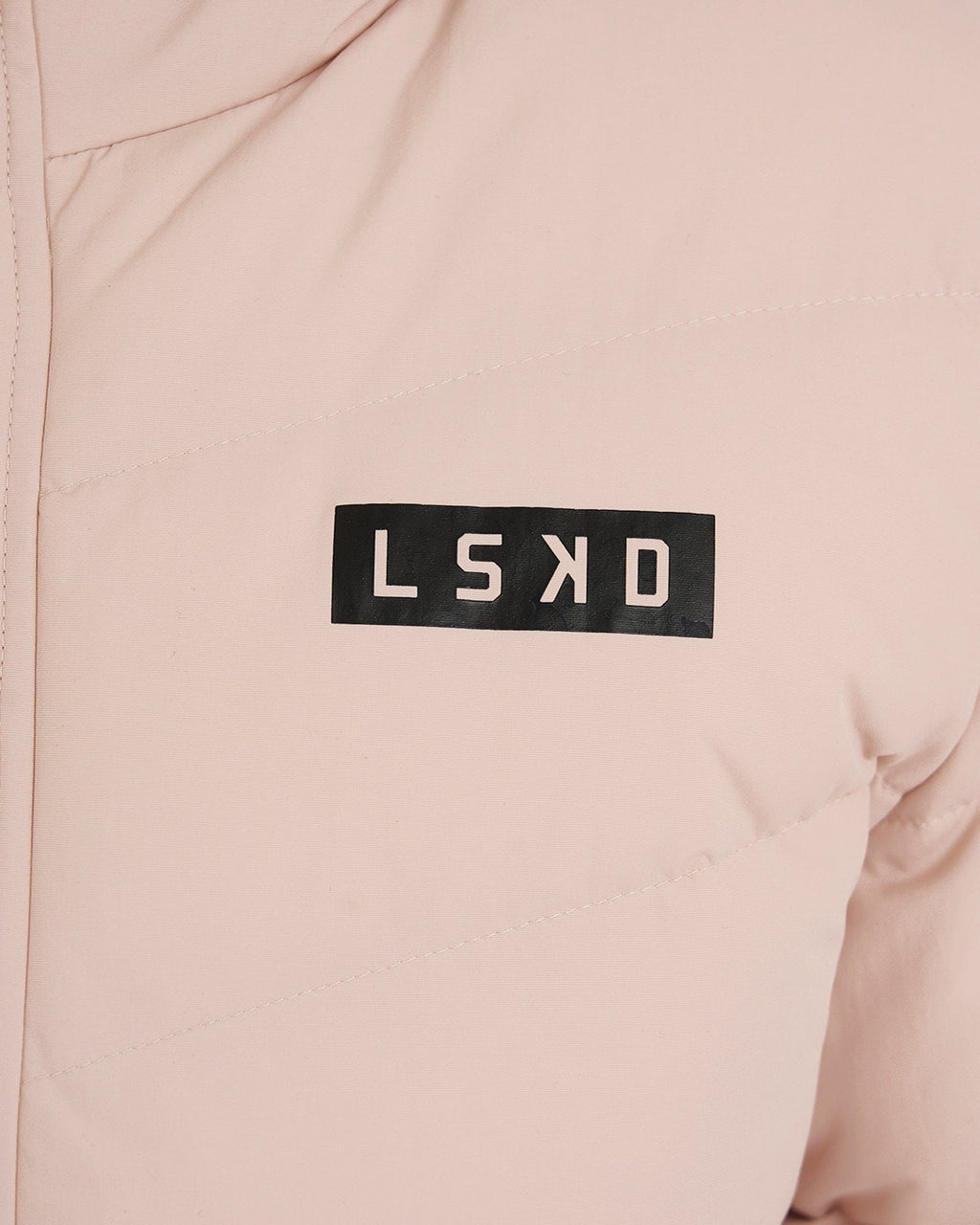 Model wearing Roasted Puffer Jacket 21 - Peach Whip