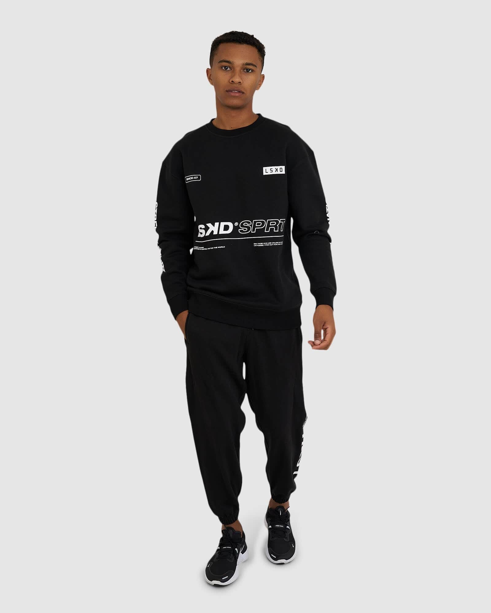 Model wearing SPRT Trackpant - Black