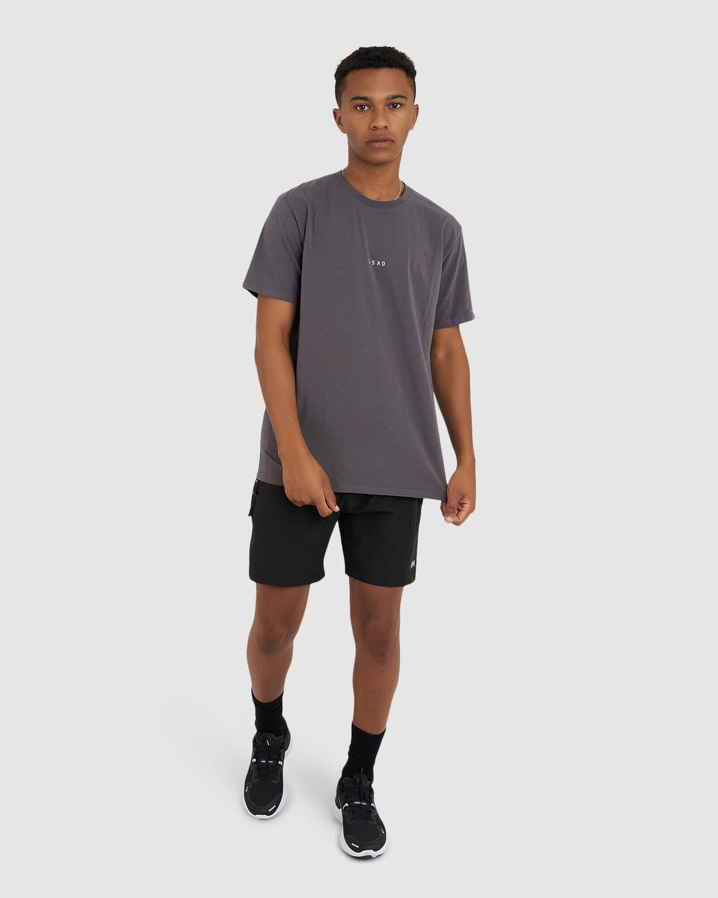 Model wearing Base Tee - Shadow