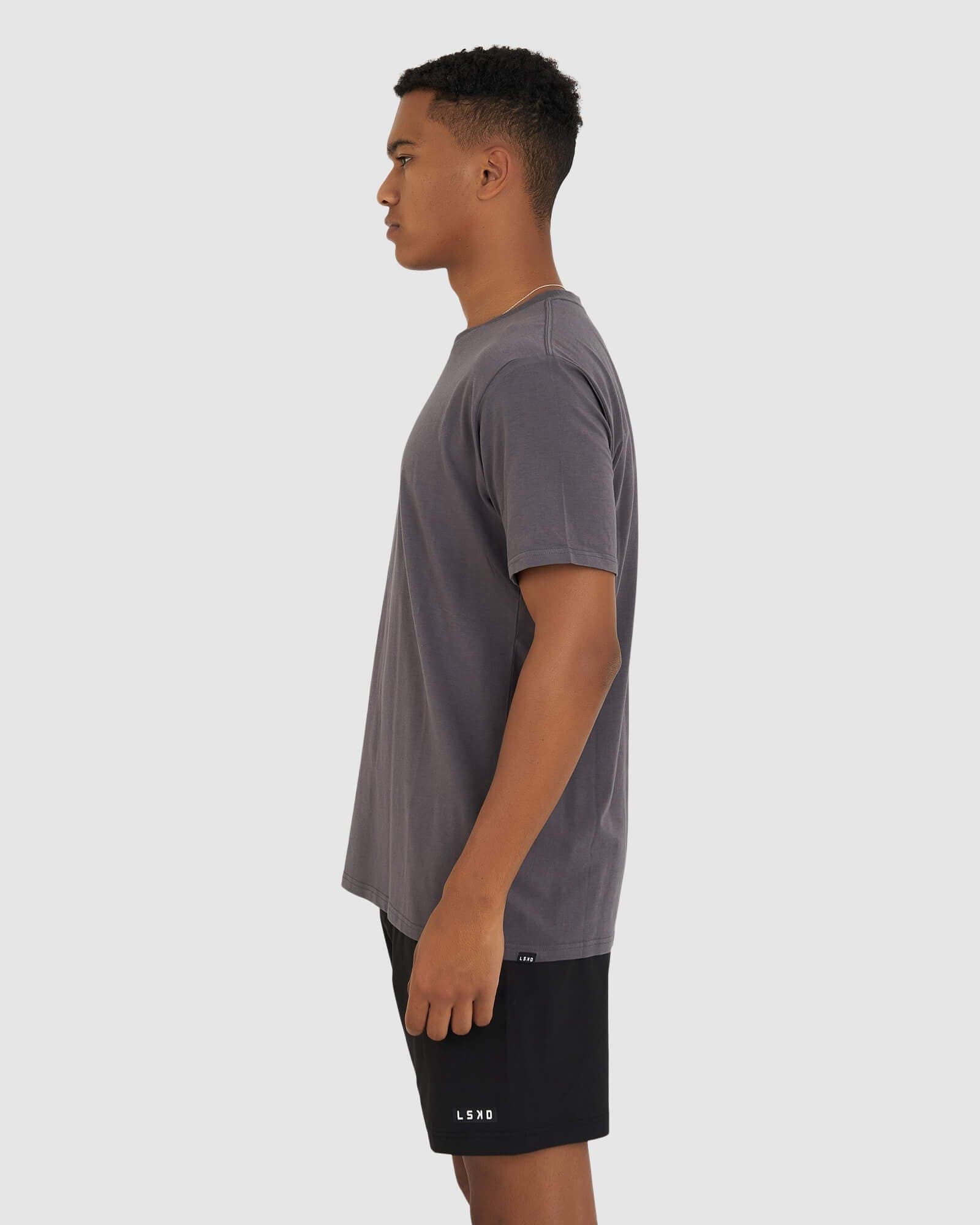 Model wearing Base Tee - Shadow