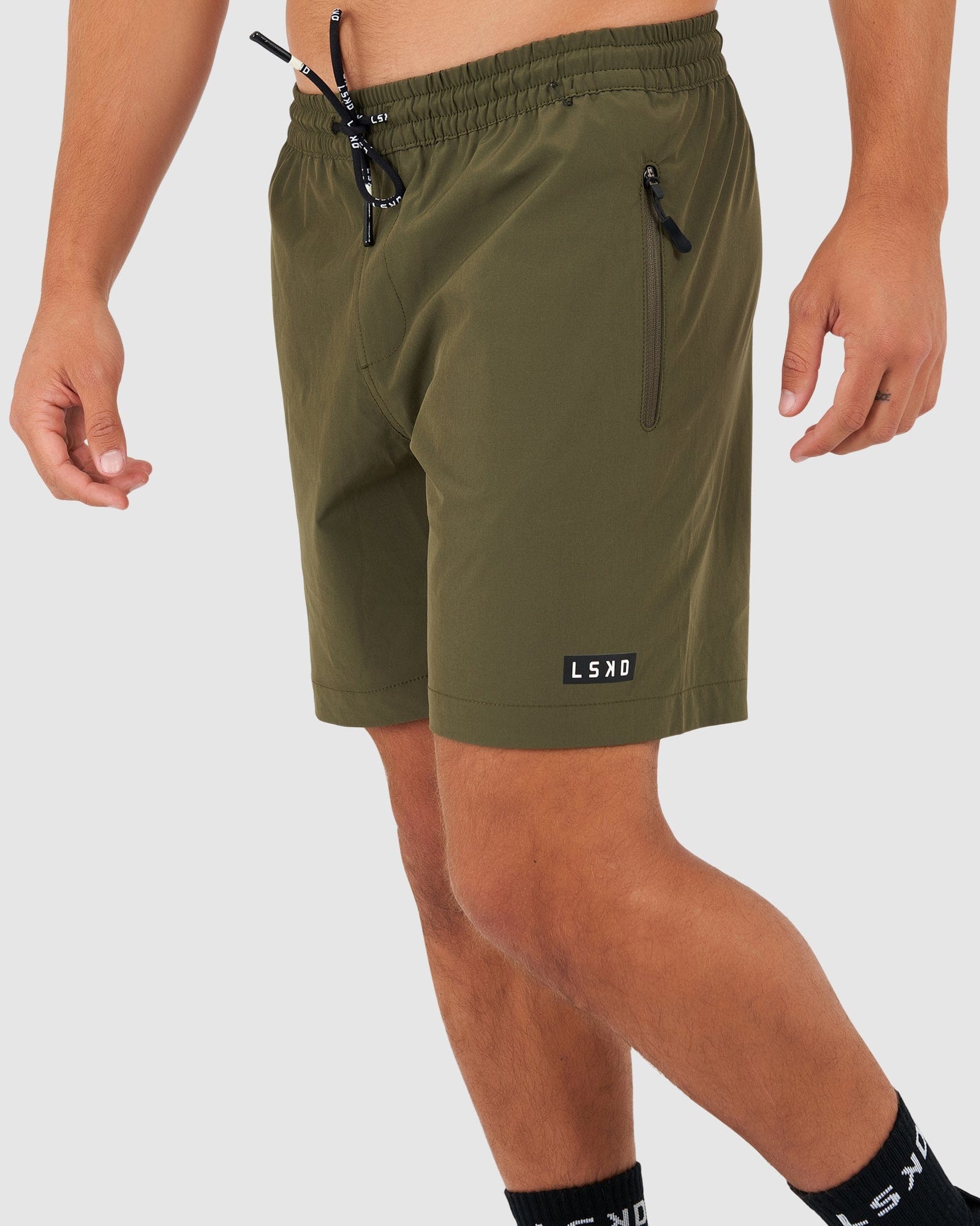 Model wearing Rep 7" Performance Short - Olive