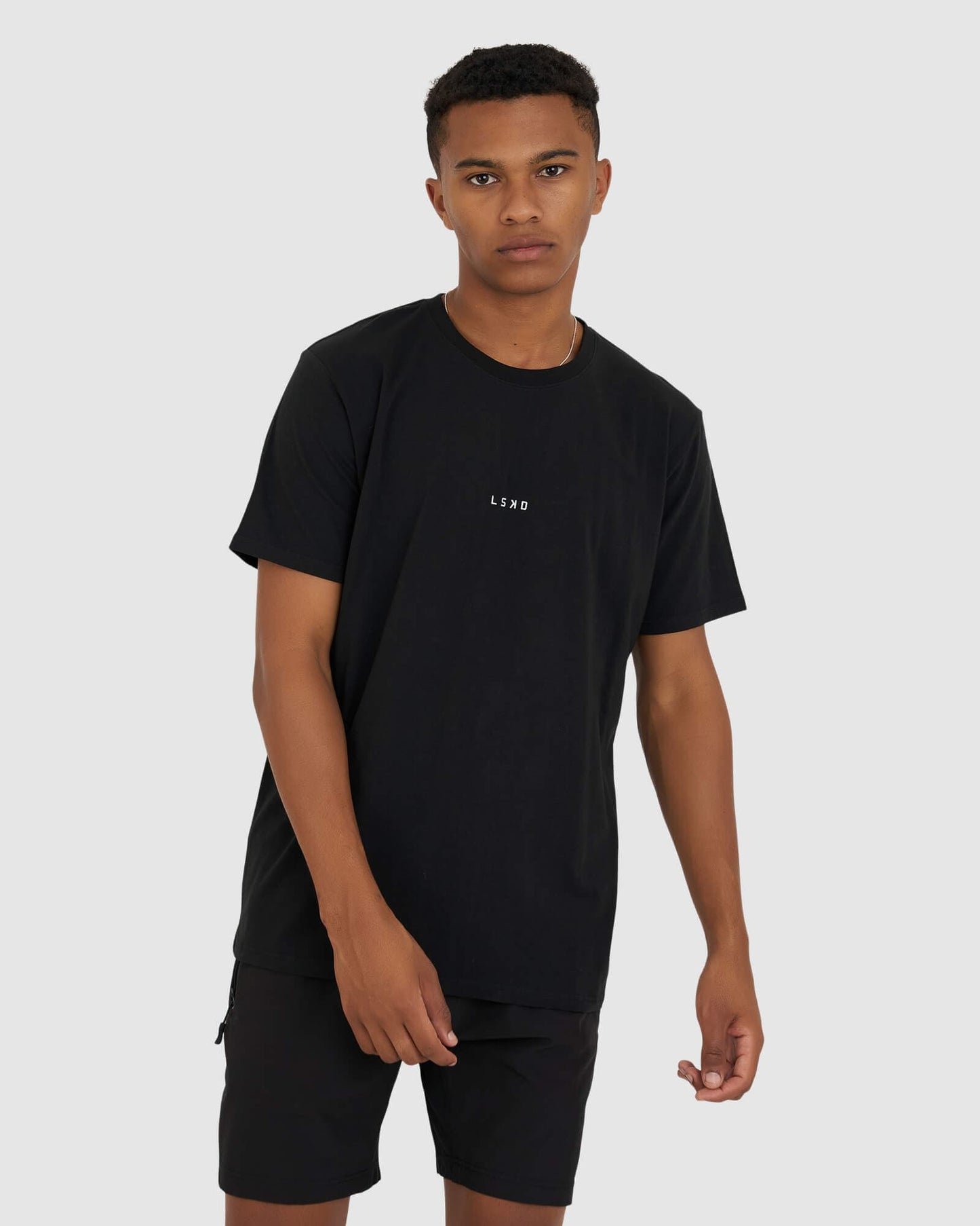 Model wearing Base Tee - Black
