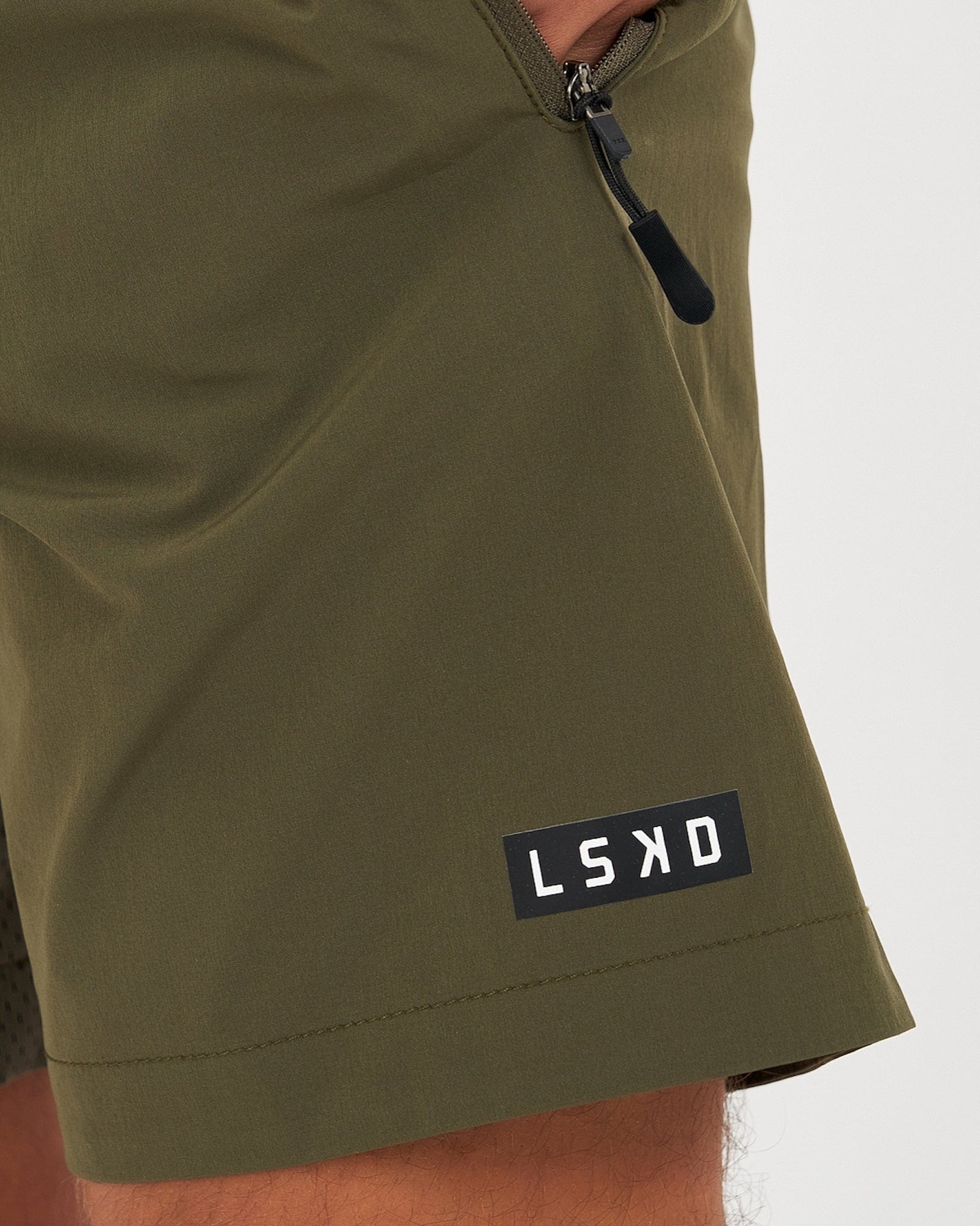 Model wearing Rep 7" Performance Short - Olive