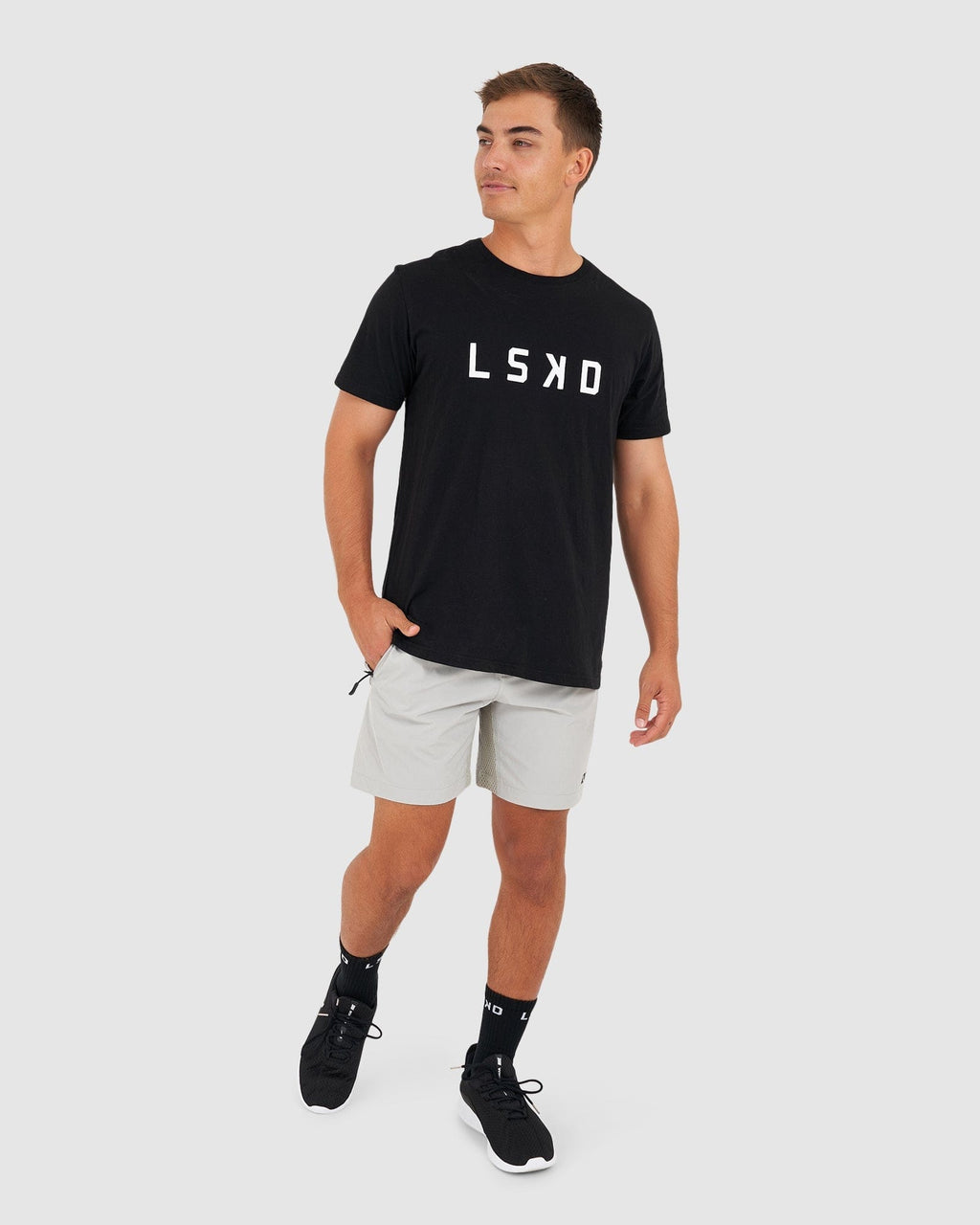 Model wearing Rep 7" Performance Short - Shark