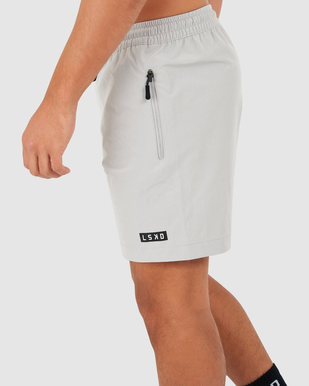 Model wearing Rep 7" Performance Short - Shark