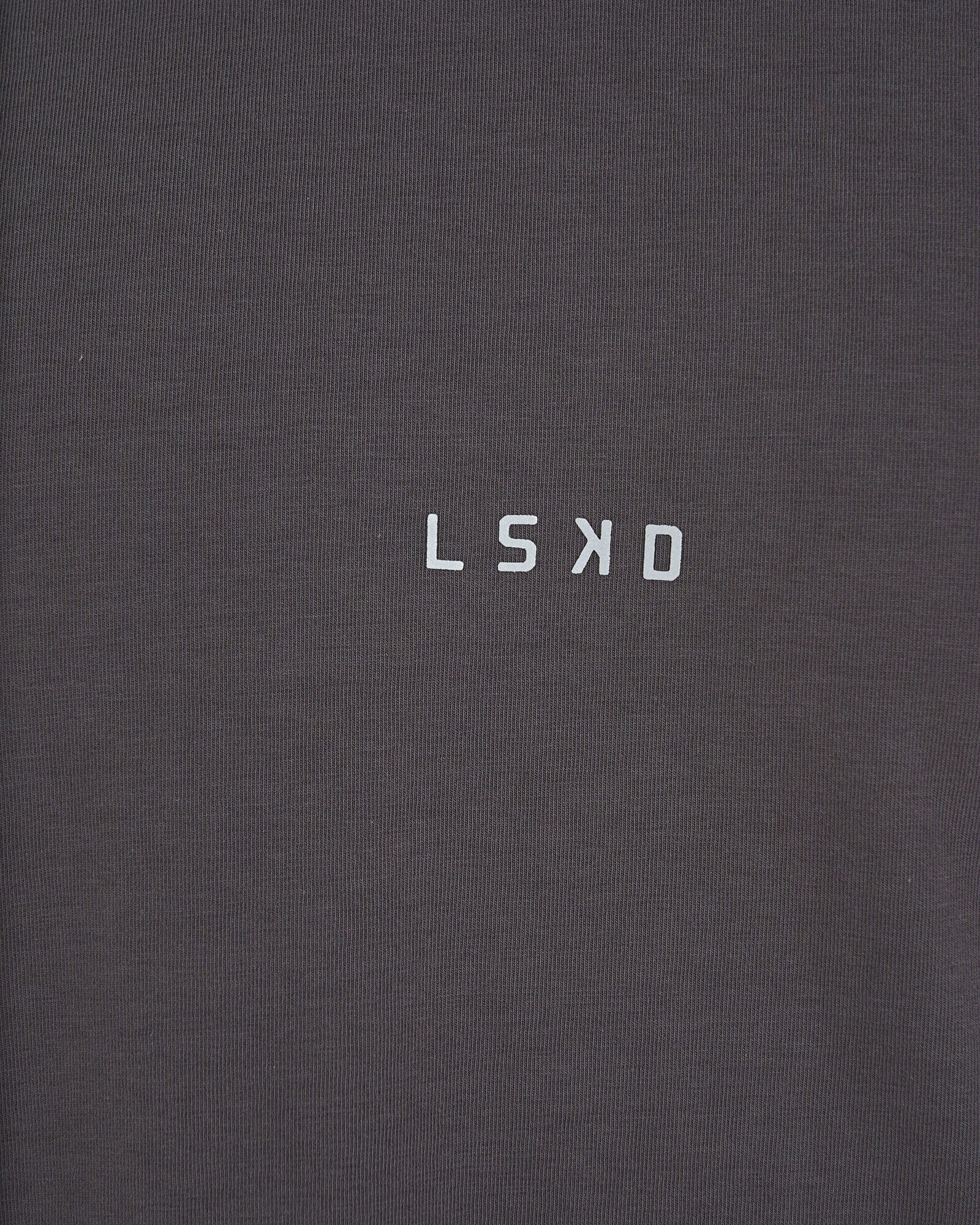 Model wearing Base Tee - Shadow