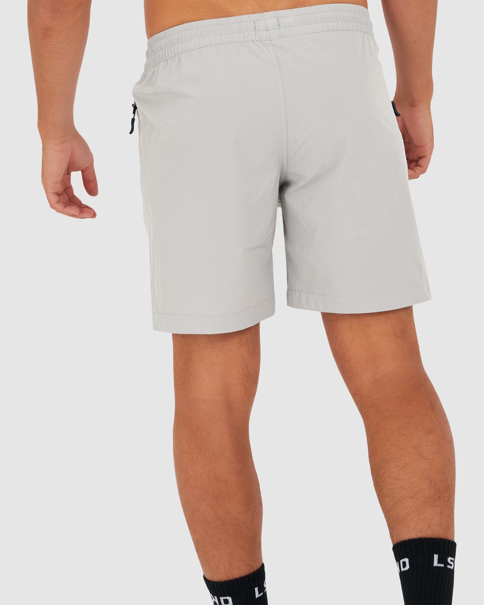 Model wearing Rep 7" Performance Short - Shark