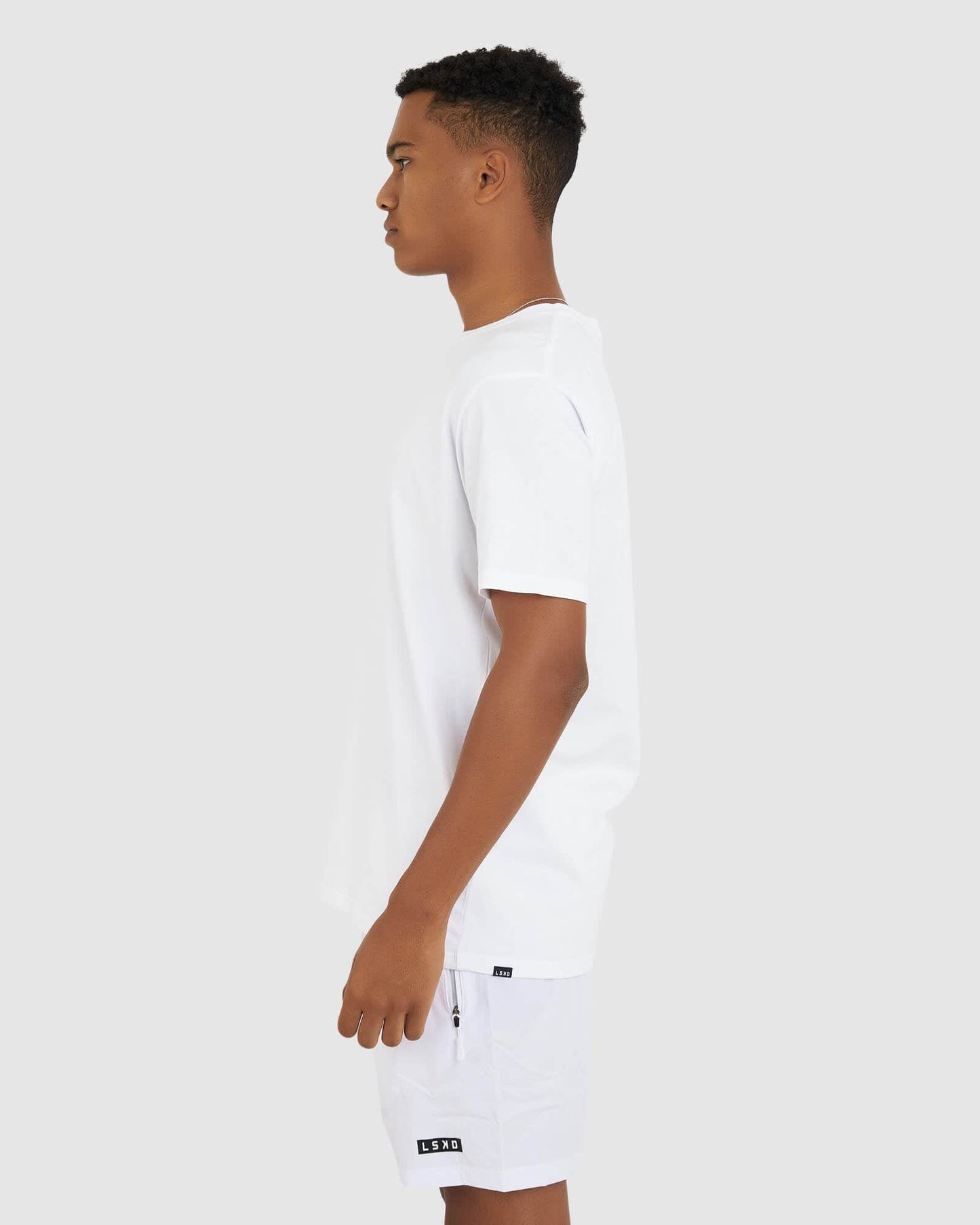 Model wearing Base Tee - White