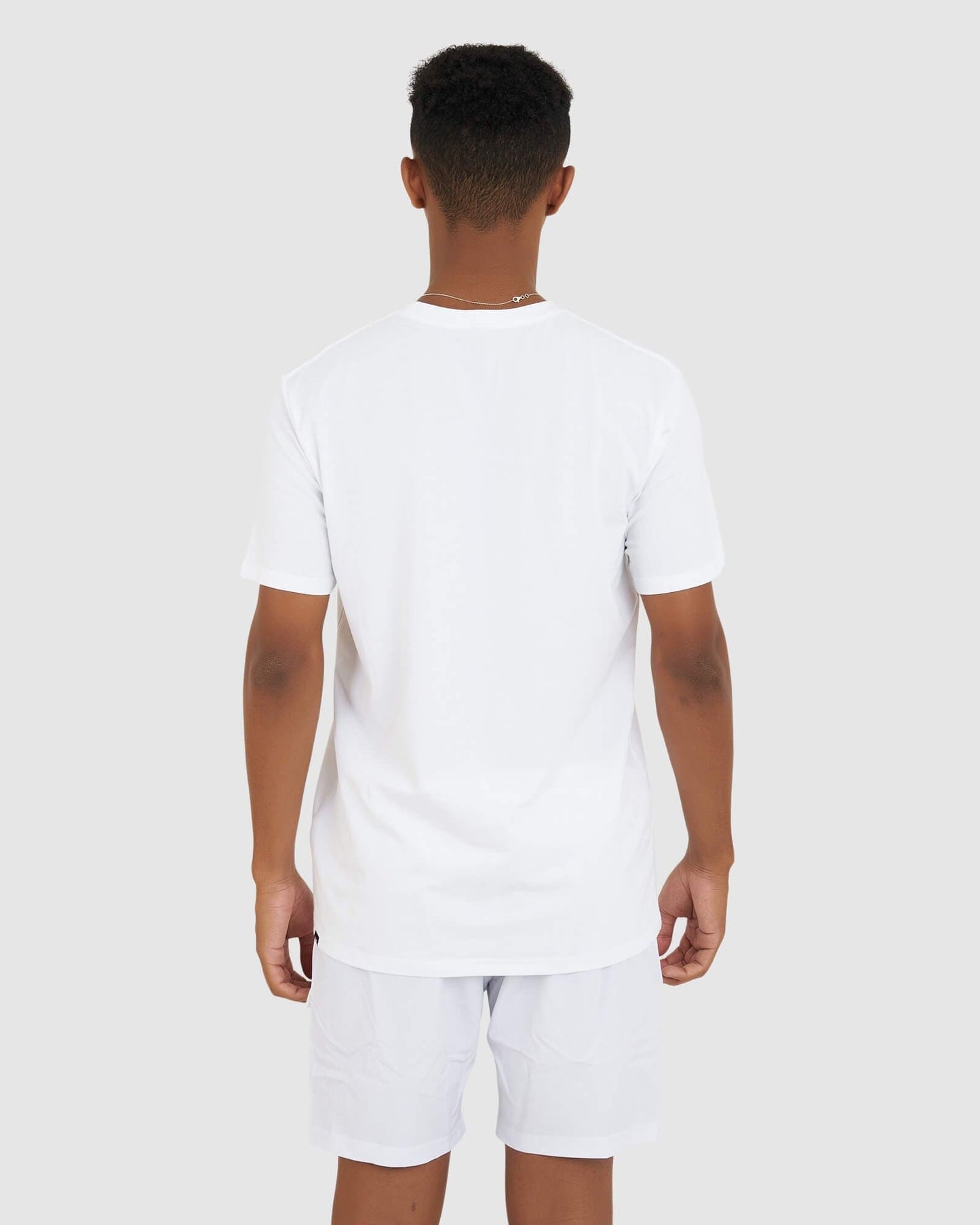 Model wearing Base Tee - White