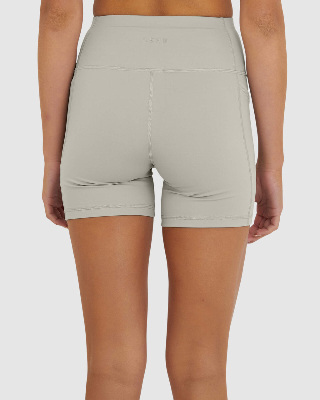 Model wearing Rep X-Short Tight Small Logo - Pussywillow